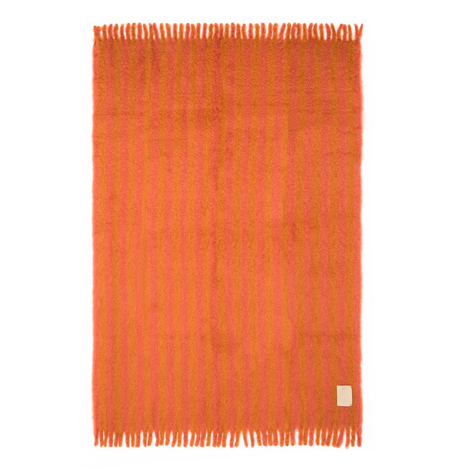 Playful yet refined our second collaboration with award-winning New York-based designer Giancarlo Valle in here. The capsule showcases our high volume hand woven mohair blankets in two unexpected multi stripe combinations finished in a thick fringe