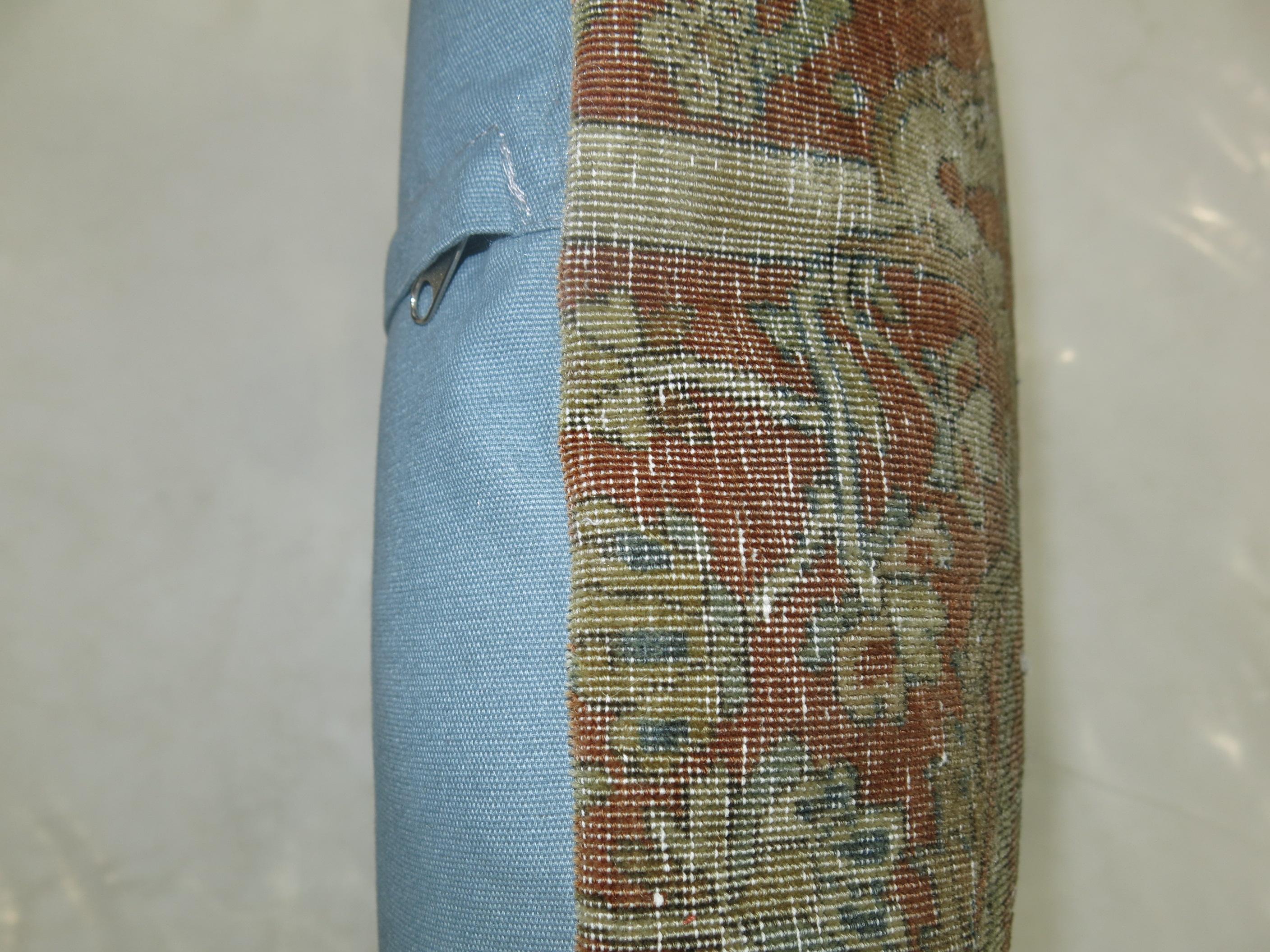 Pillow made from a shabby chic antique Persian rug with a formal palette in blue and green accents.

Measures: 19” x 20”.