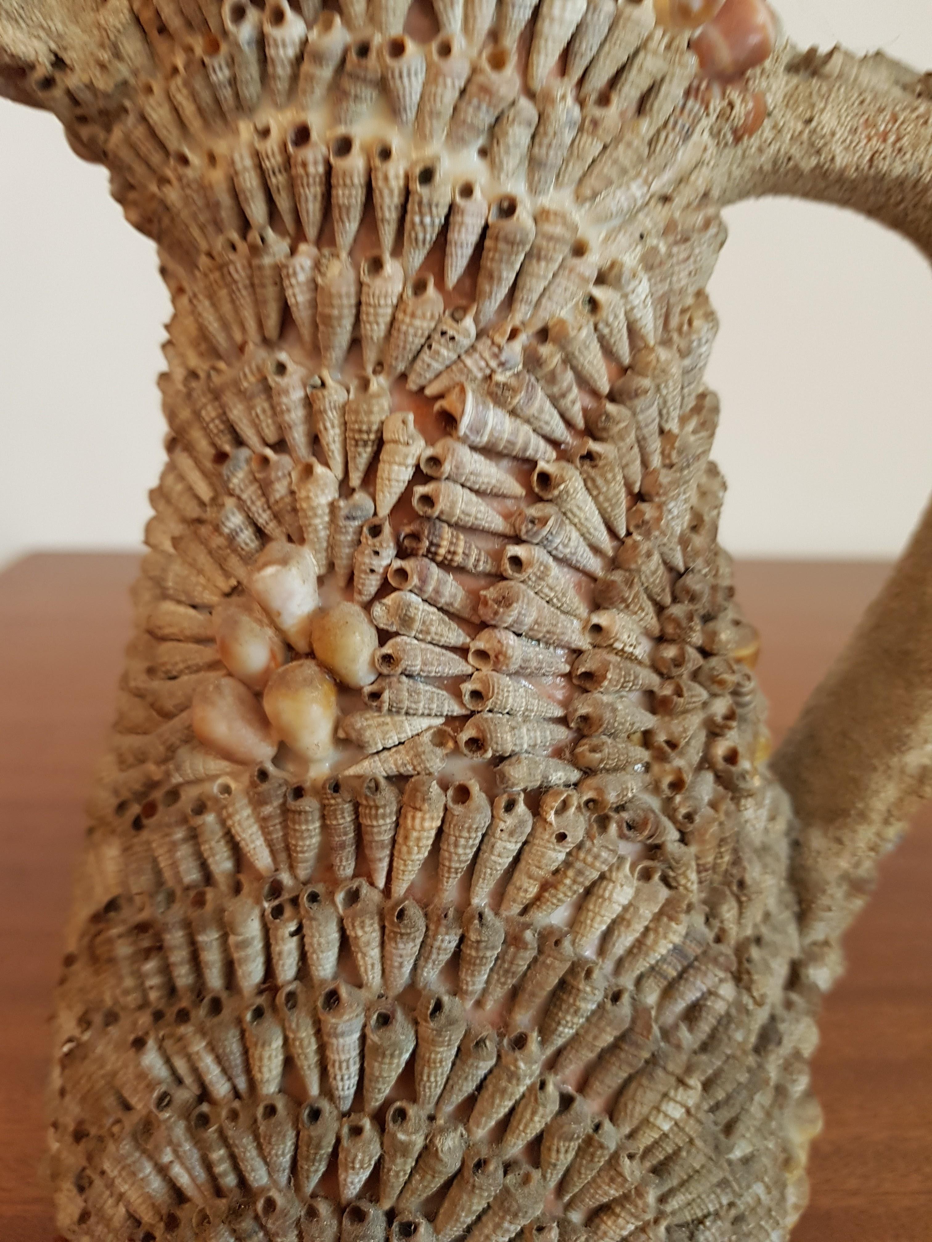 Decorative French vase encrusted with small shells, most likely from the South of France.