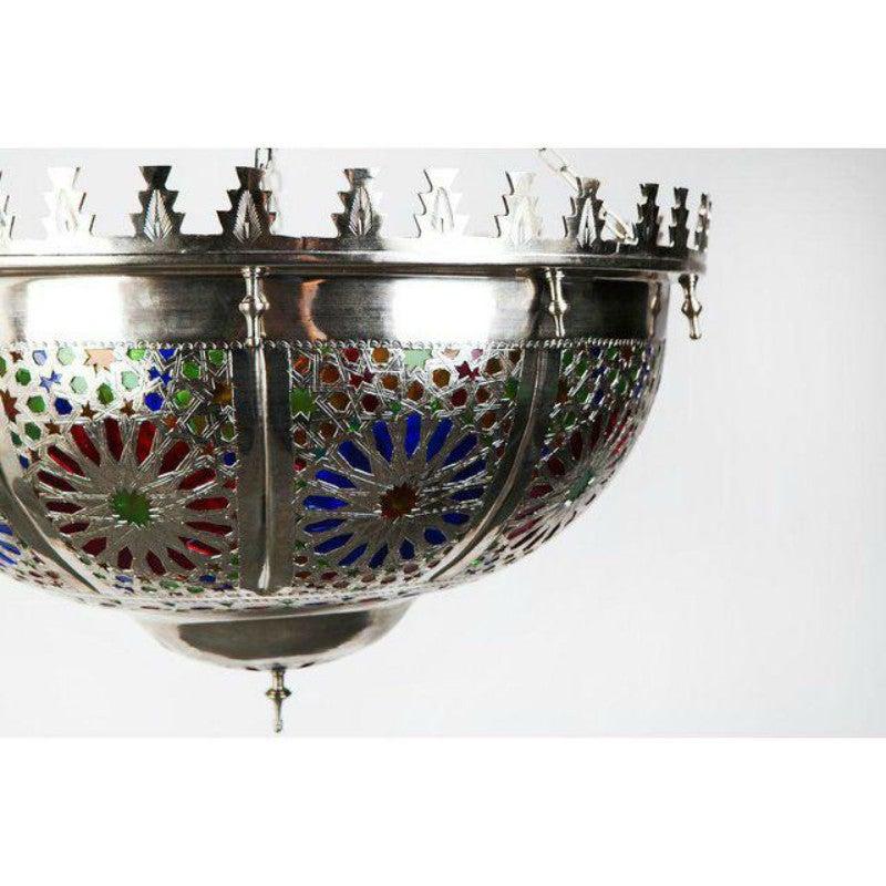 This captivating and elegant metallic round lamp has been created in the Iraqi style and features individually wrought multicolored glass panes and elaborate hand-tooled design work. Adds exotic distinction to any living space.

 