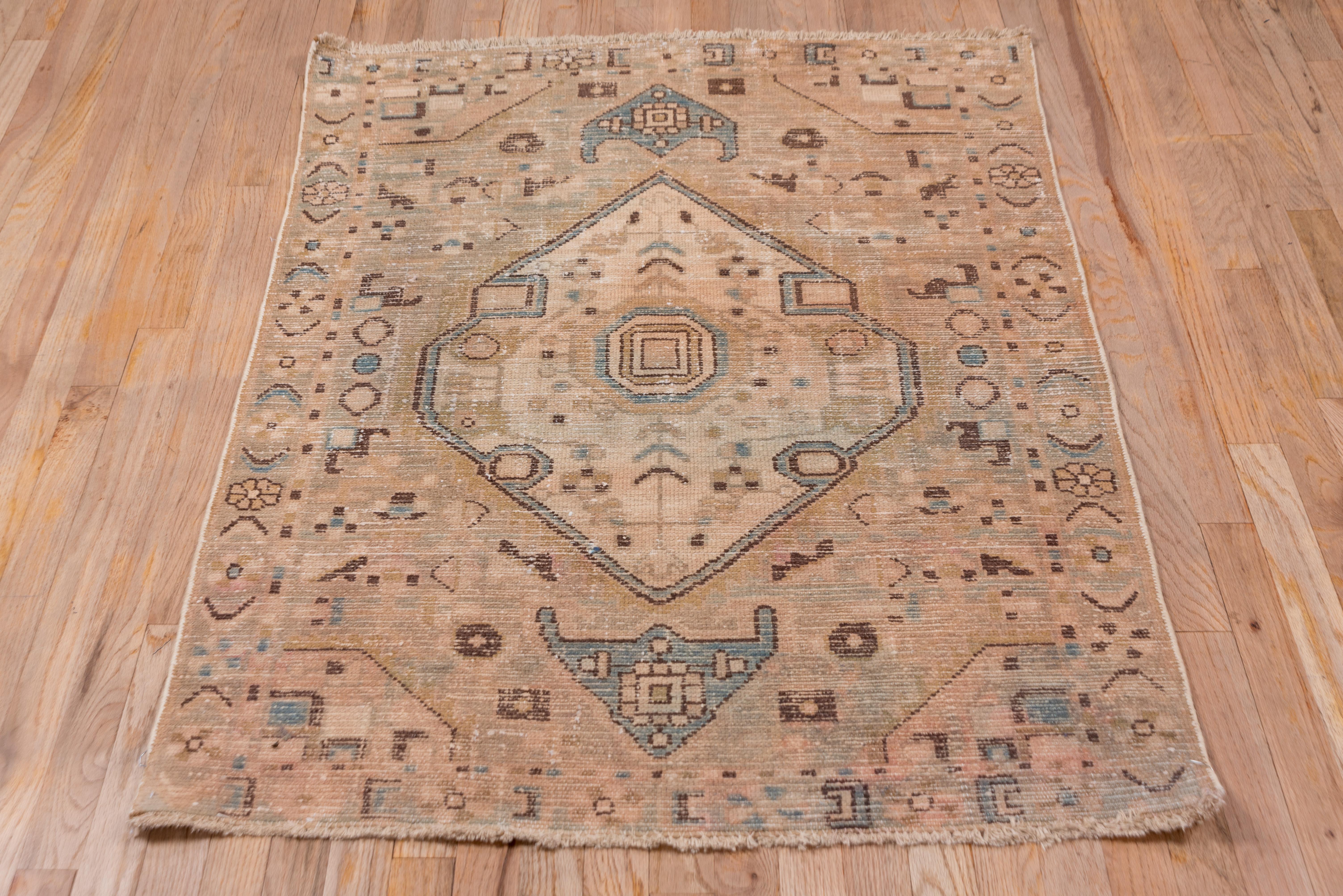 A large, notched ecru lozenge medallion dominates the ligh beige and brown field. Anchor pendants above and below. Small rosettes and squares are scattered symmetrically. Border with blue accents, rosettes and C-shaped leaves.
 