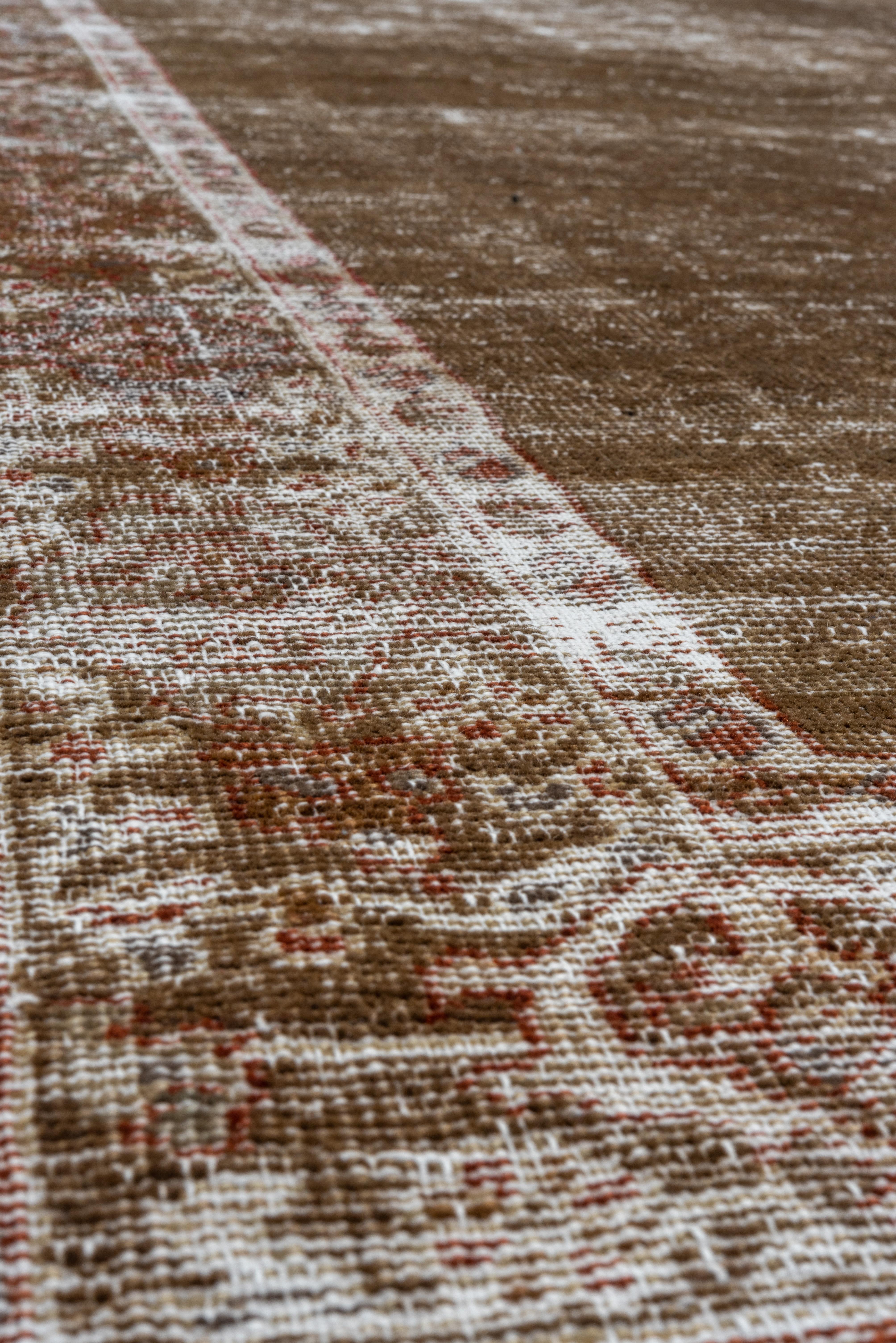 This red field west Persian rustic carpet is severely compromised with vertical wear areas right to the off-white cotton foundation.
