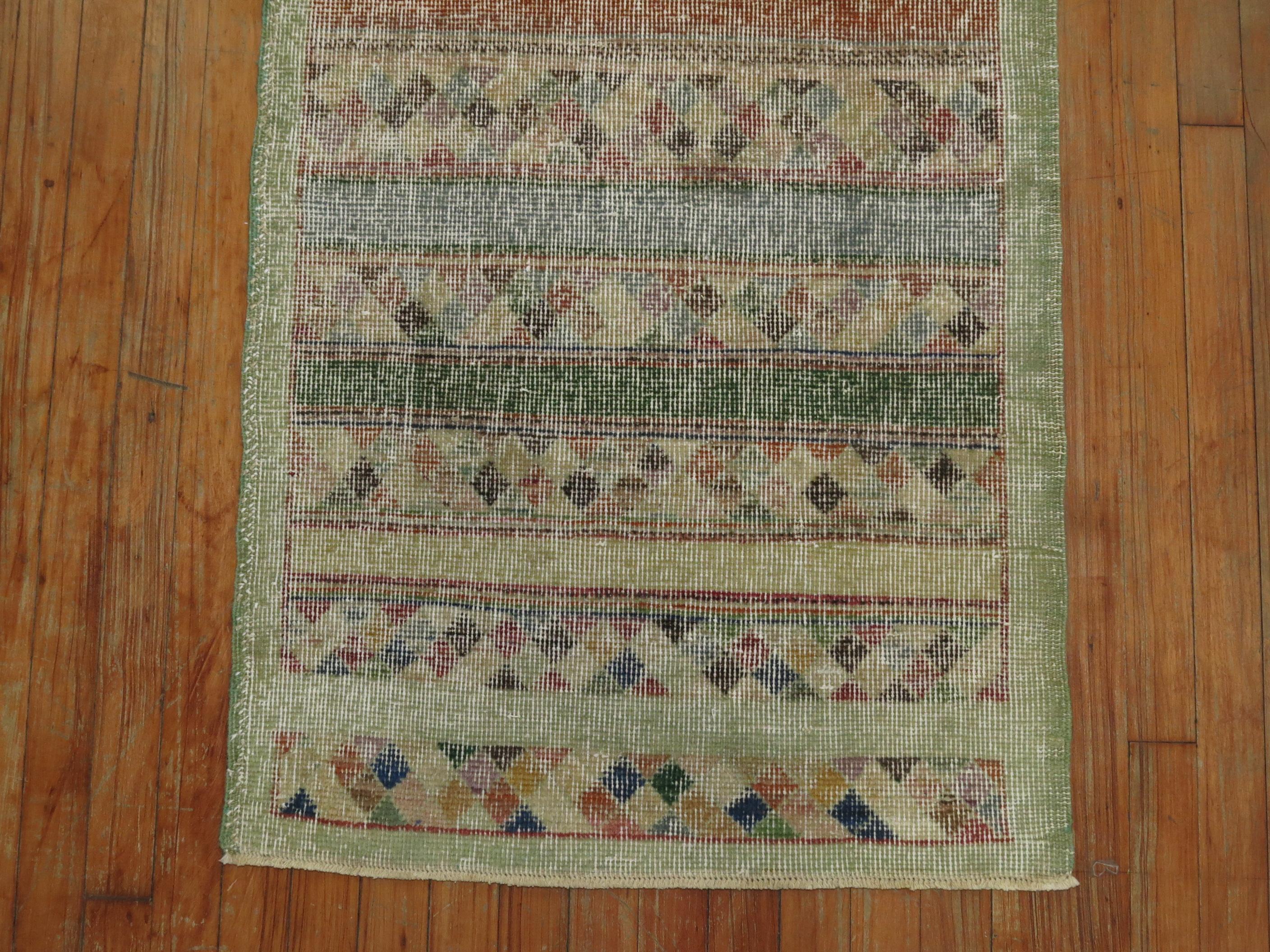 A mid-20th century shabby chic Turkish rug mat.