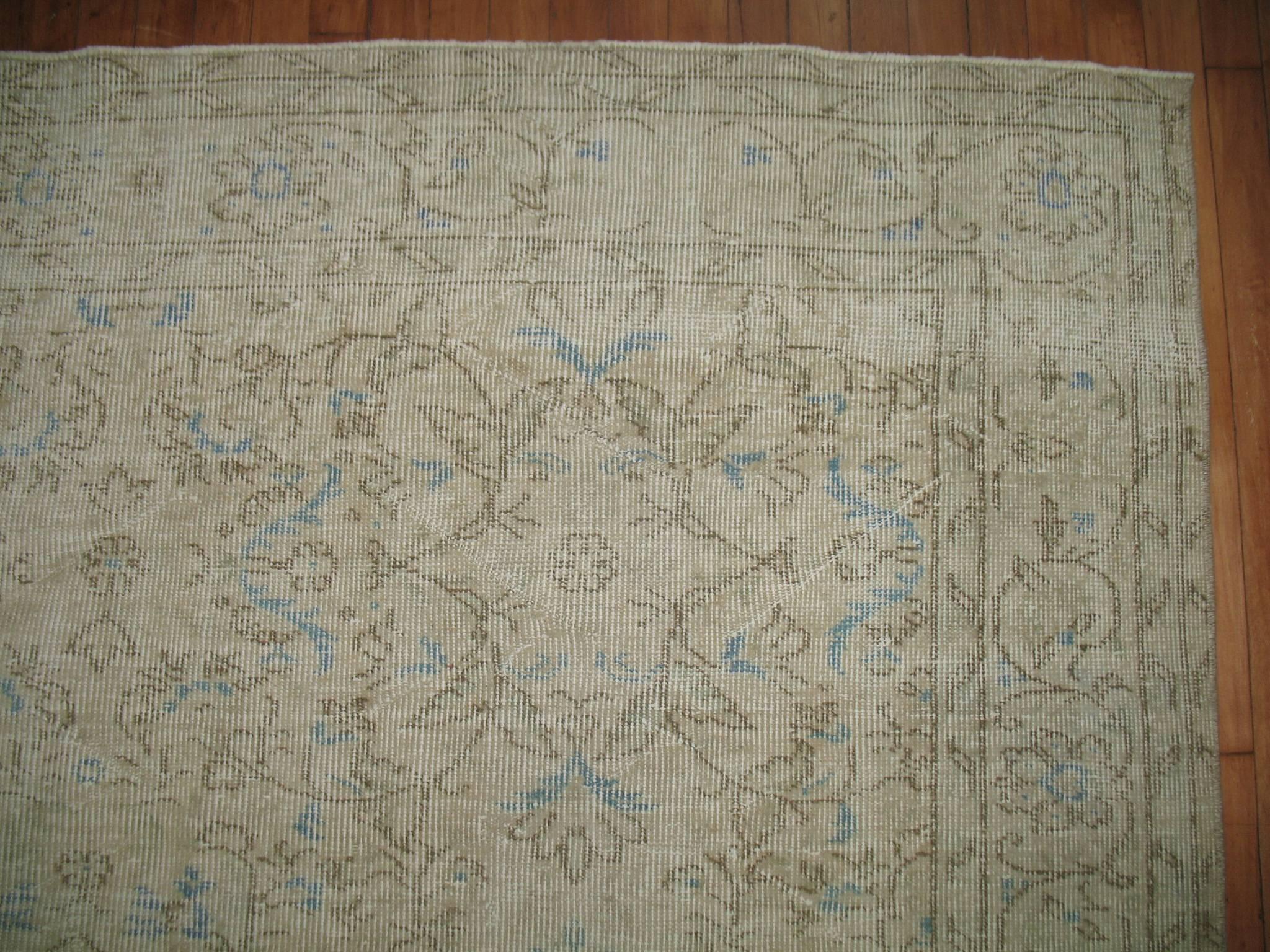 Distressed Small room size one of a kind room Turkish rug with pops of light blue.

Measures: 6'7'' x 10'.
