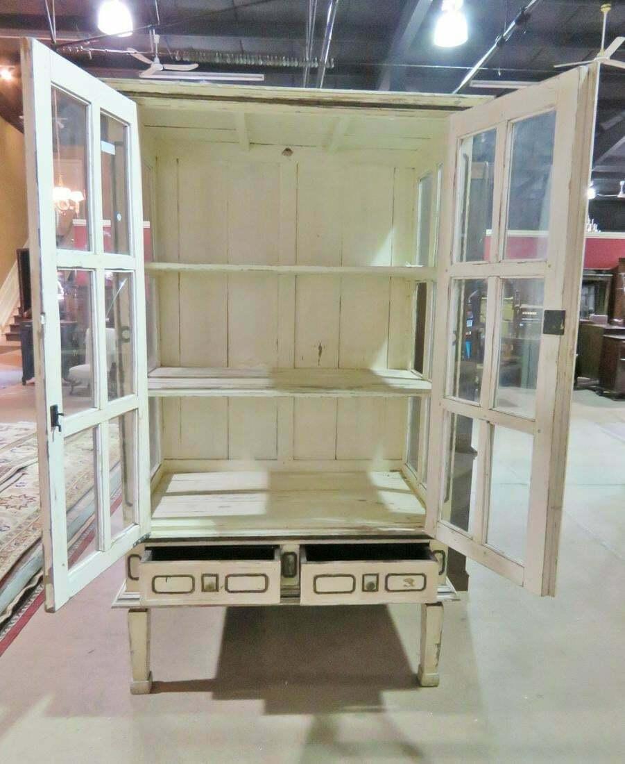 This is a great piece for the right person. If you are looking for a shabby chic primitive cabinet that is antique. This is for you. Look at the chipping white antique paint! Great character and charm.

Measures: 79 1/2