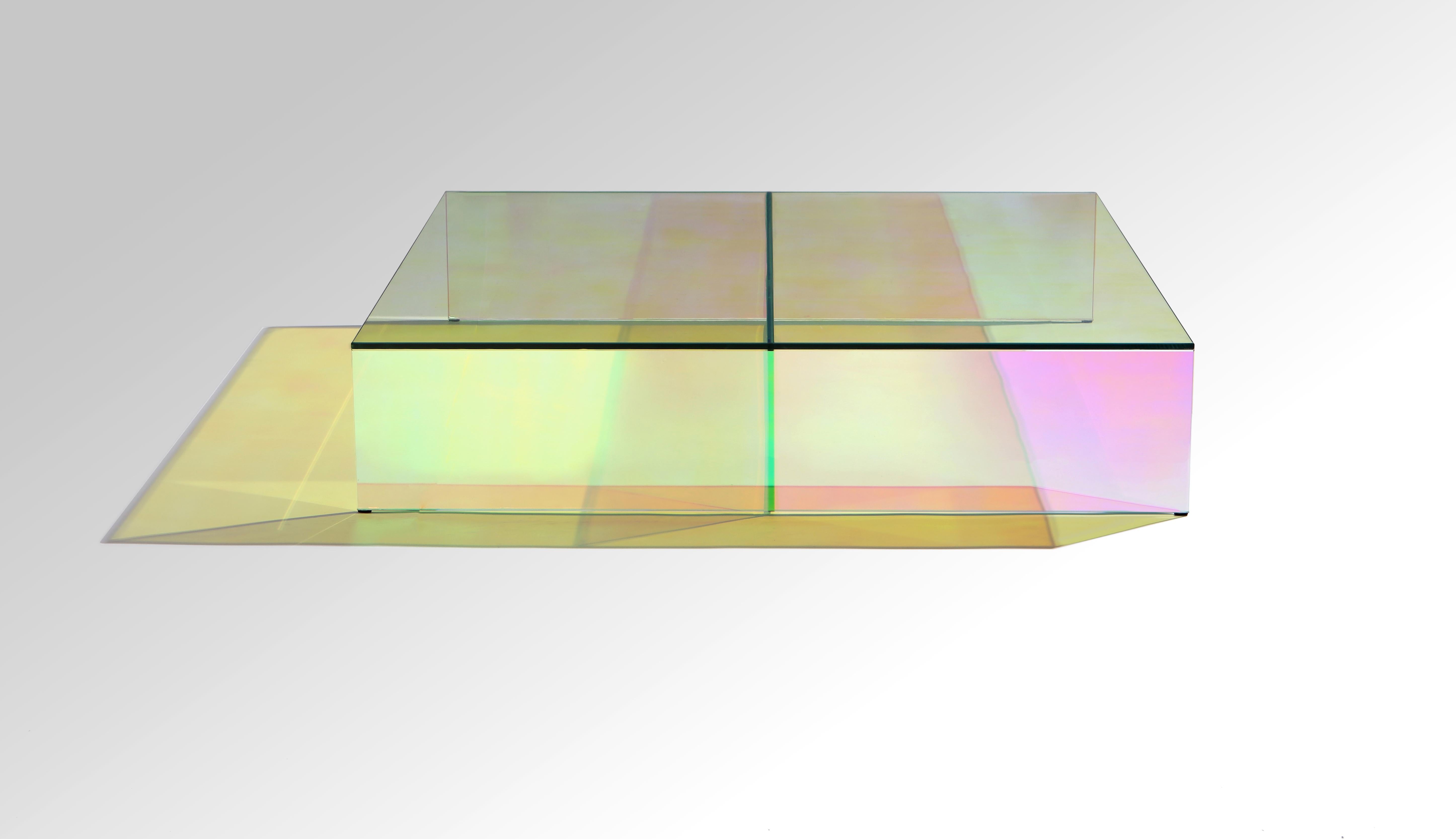 glass coffee table with iridescent film on all sides and minimalist structure