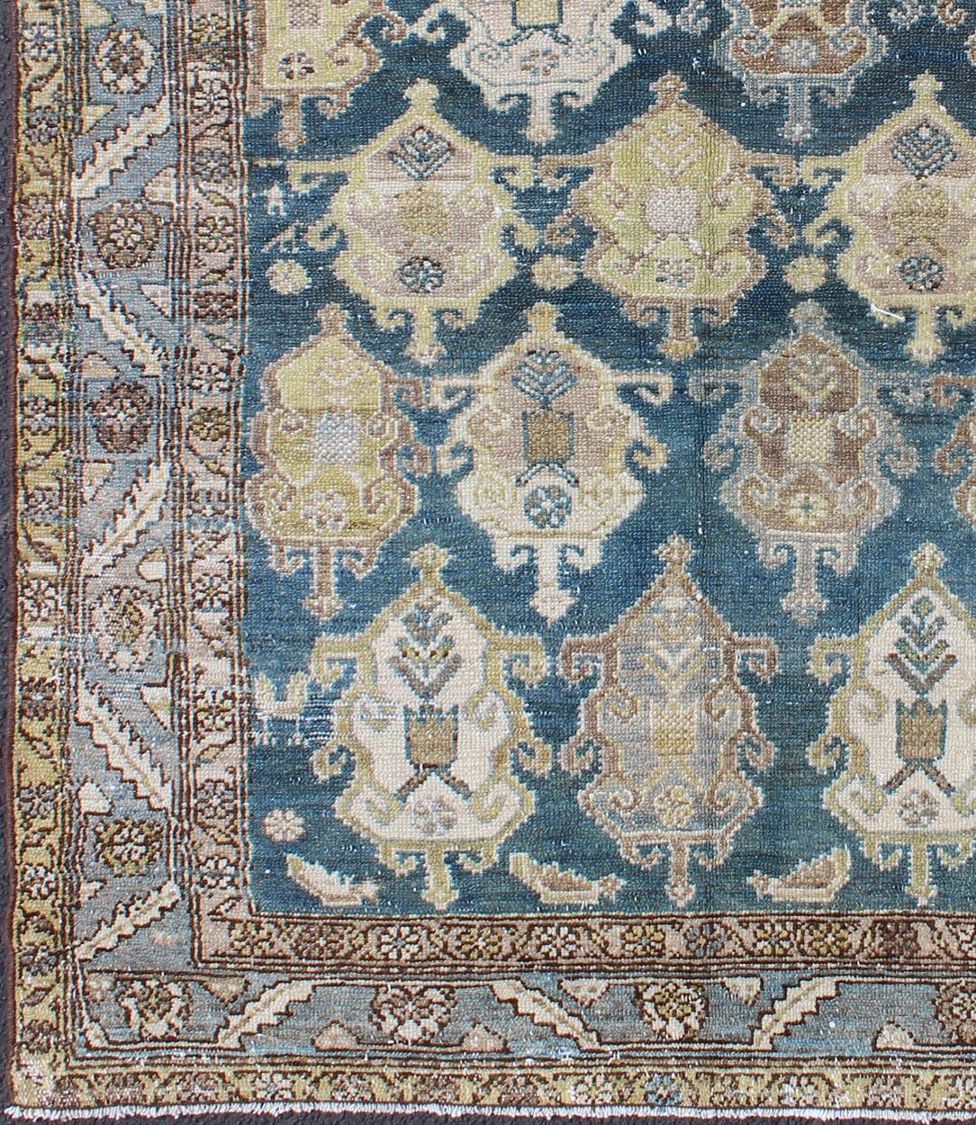 All-over large scale design in dark blue Persian Malayer antique rug, rug na-180707, country of origin / type: Iran / Malayer, circa 1920.

This beautiful antique early 20th century Persian Malayer carpet features an all-over design of repeating