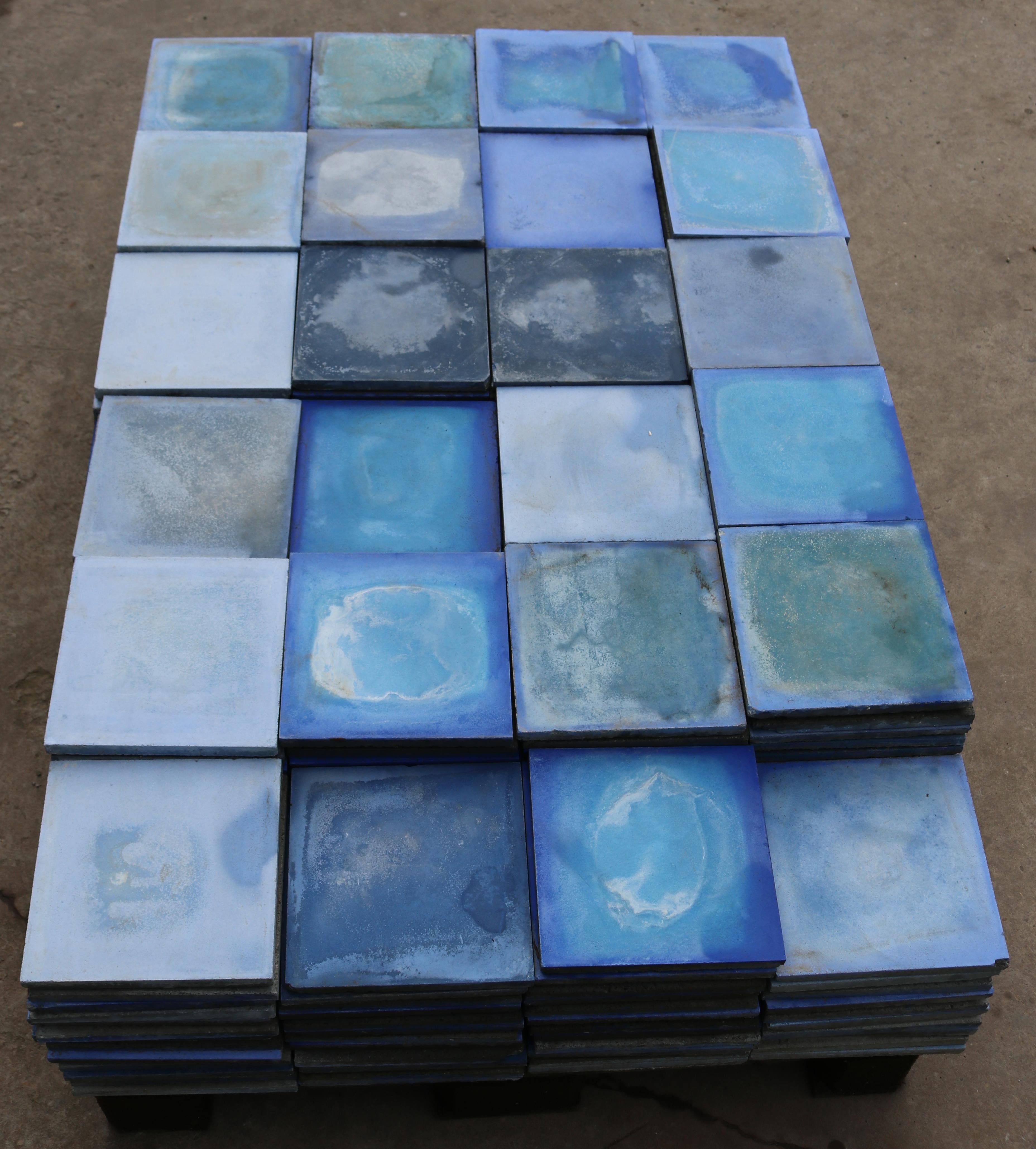 A batch of 330 reclaimed encaustic cement floor tiles. These tiles will cover 13.2 m2 or 142 sq ft.
 
Mixed shades of blue, raging from very pale to very dark.