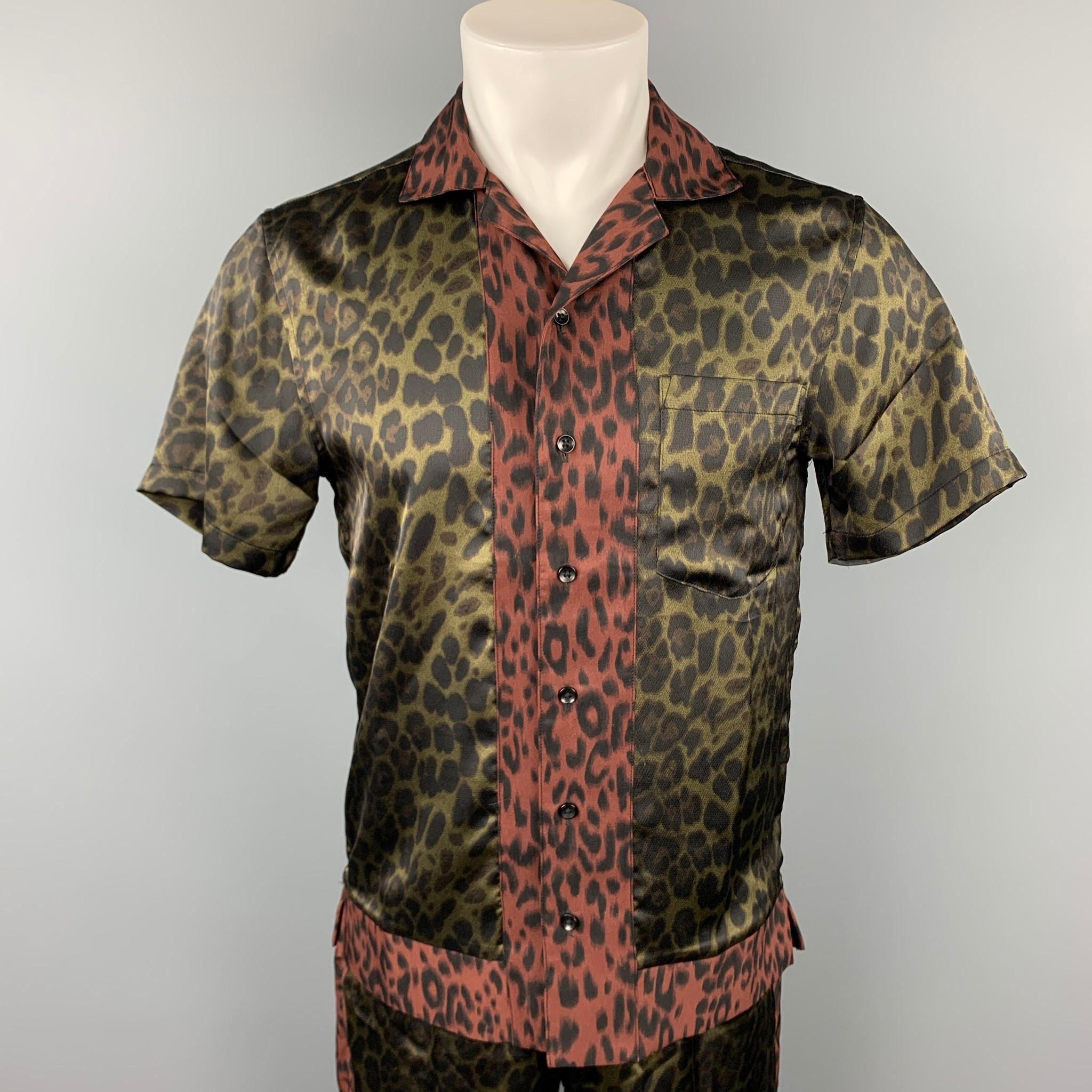 SHADES OF GREY by MICAH COHEN two piece set comes in a olive animal print polyester featuring a camp style, front pocket, buttoned closure, and matching shorts. 

Very Good Pre-Owned Condition.
Marked: S

Measurements:

-Shirt
Shoulder: 17.5