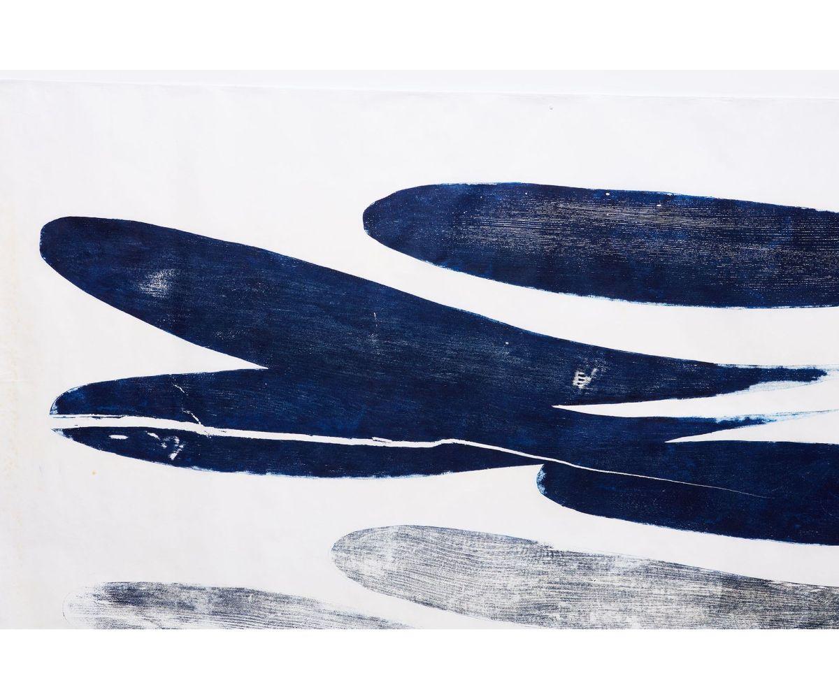 A large scale woodblock by British artist Julian Meredith, titled 'shadow pod'. The artwok was made by the artist on rice paper and colored with indigo ink using a woodblock technique. Meredith is noted for his beautiful depictions of whales and