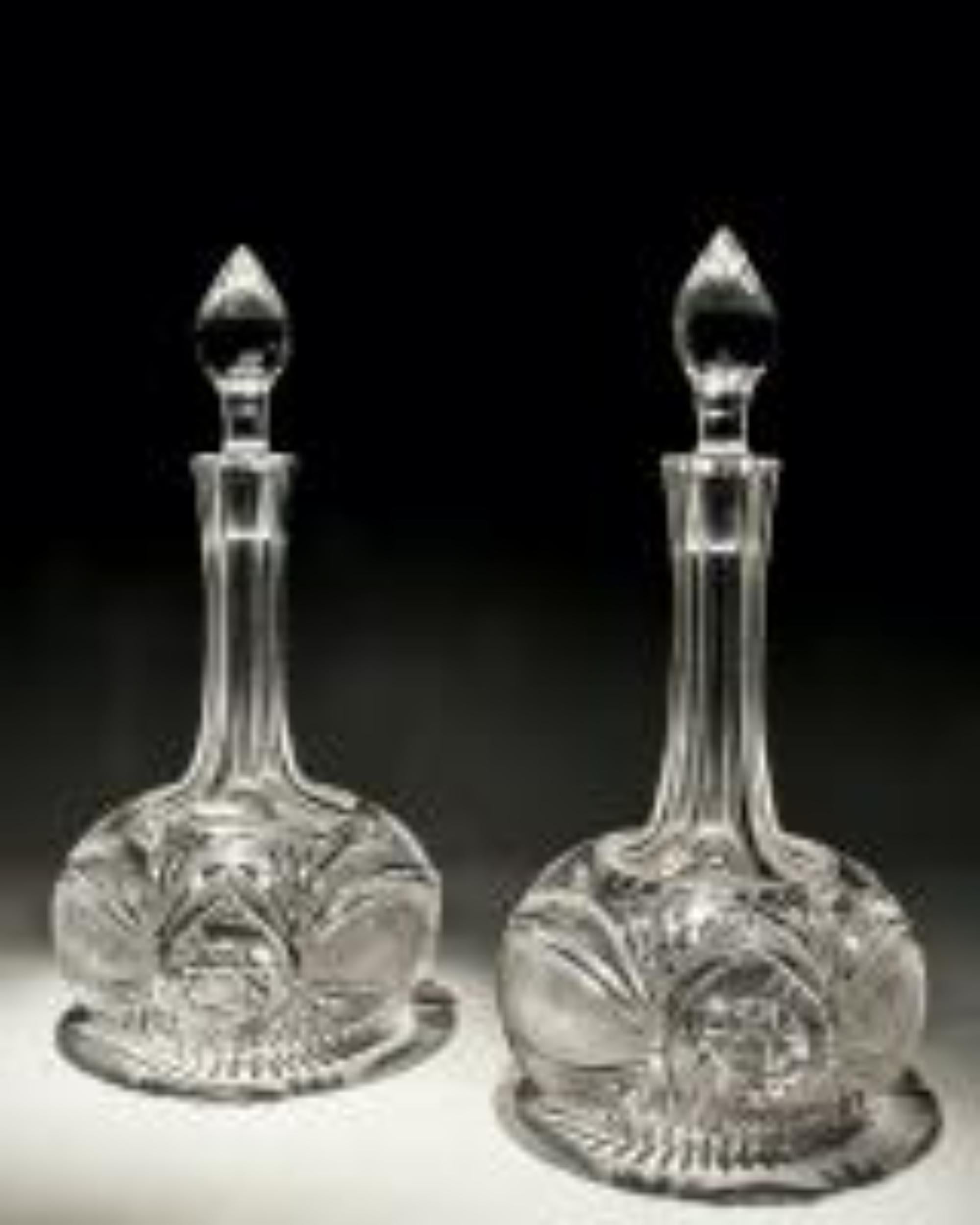 A pair of elaborately cut shaft and globe Victorian decanters.

England, circa 1880.

Measures: Height: 29.5 cm (11 1/2