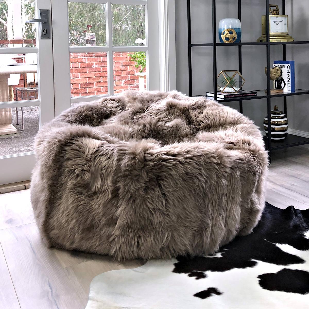 

After a long day at work, there is no better way to relax than submerging into the oozing comfort of our fur bean bag chair cover.

Handcrafted in Australia using the finest and genuine Australian Merino sheepskins in our delicious fashion-dyed