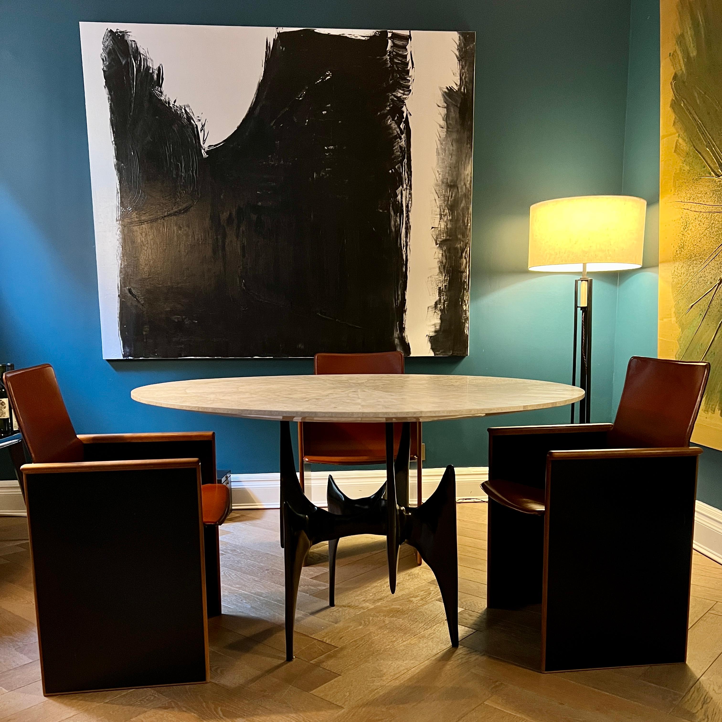 Ella Center / Dining Table in stock at the Elan Atelier New York showroom. 

A metalwork showcase. The Ella Table has mid-century modern stylistic exuberance, with modern poise and judicious restraint. 

Finish:
Base: Cast bronze with antique