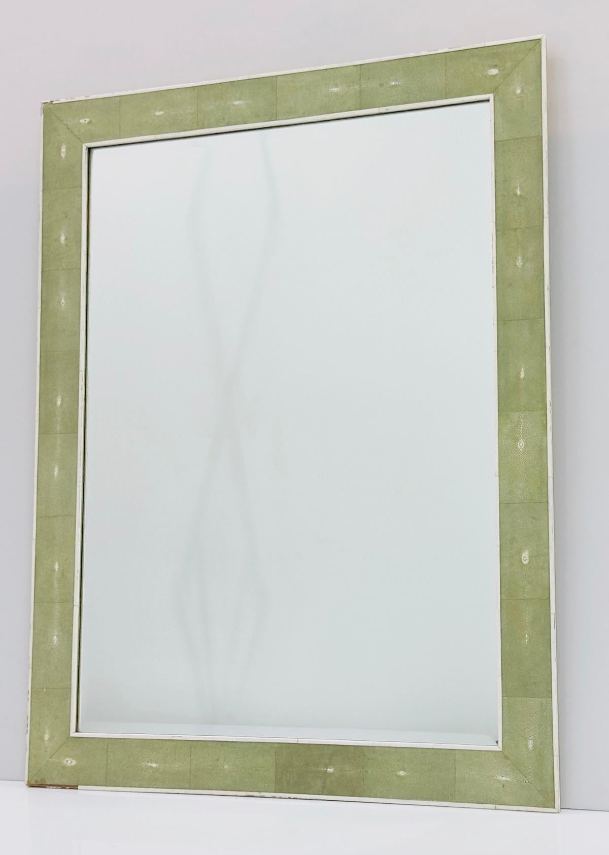 Elevate your home decor with the exquisite Shagreen and Bone Wall Mirror by Sylvan of San Francisco, signed by the esteemed designer. This stunning piece features a wooden frame accented with elegant shagreen and bone trim, creating a sophisticated