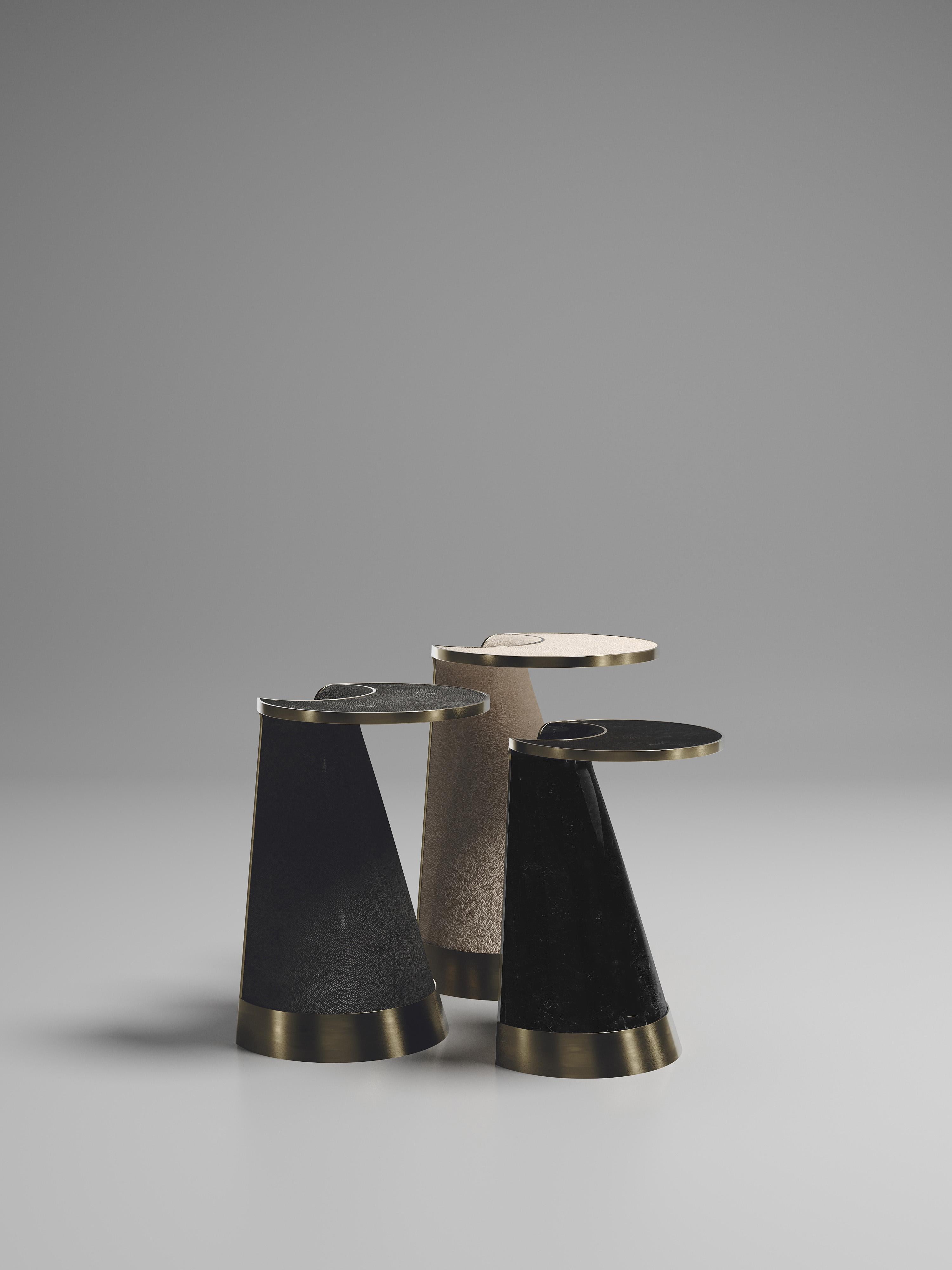 The Nymphea set of 3 nesting side tables by R & Y Augousti explore the brand's iconic DNA of bringing old world artisanal craft into a contemporary and utterly luxury feel. These pieces are done in different finish variations including shagreen, pen