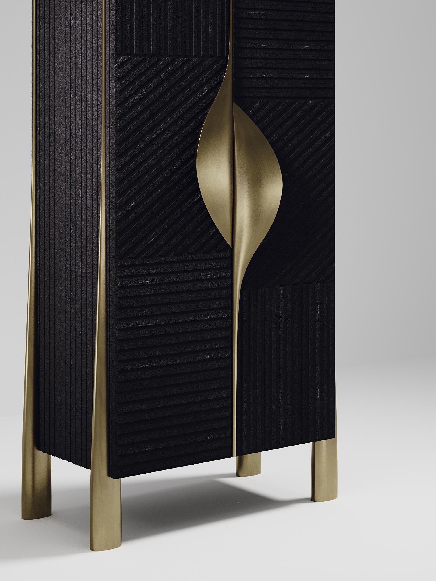 The wave bar cabinet by R&Y Augousti is one of a kind statement piece. The overall piece is inlaid in black shagreen, with the exterior hand-carved in an updated version of the signature Augousti 