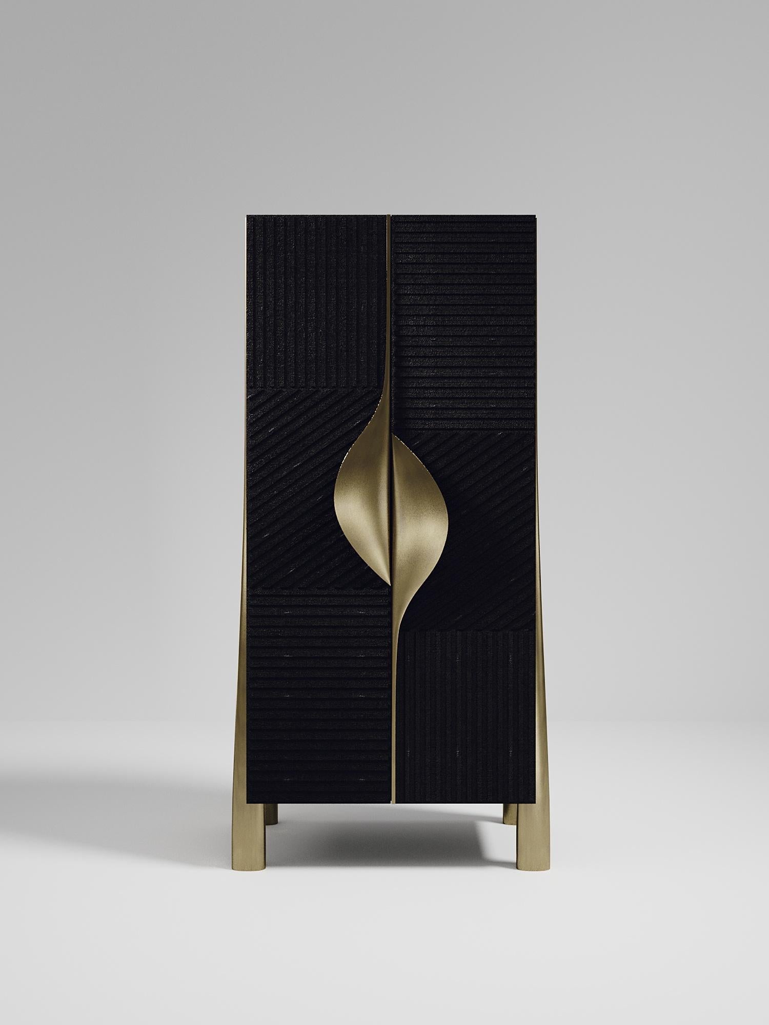 The Wave Bar Cabinet by R&Y Augousti is one of a kind statement piece. The overall piece is inlaid in black shagreen, with the exterior hand-carved in an updated version of the signature Augousti 