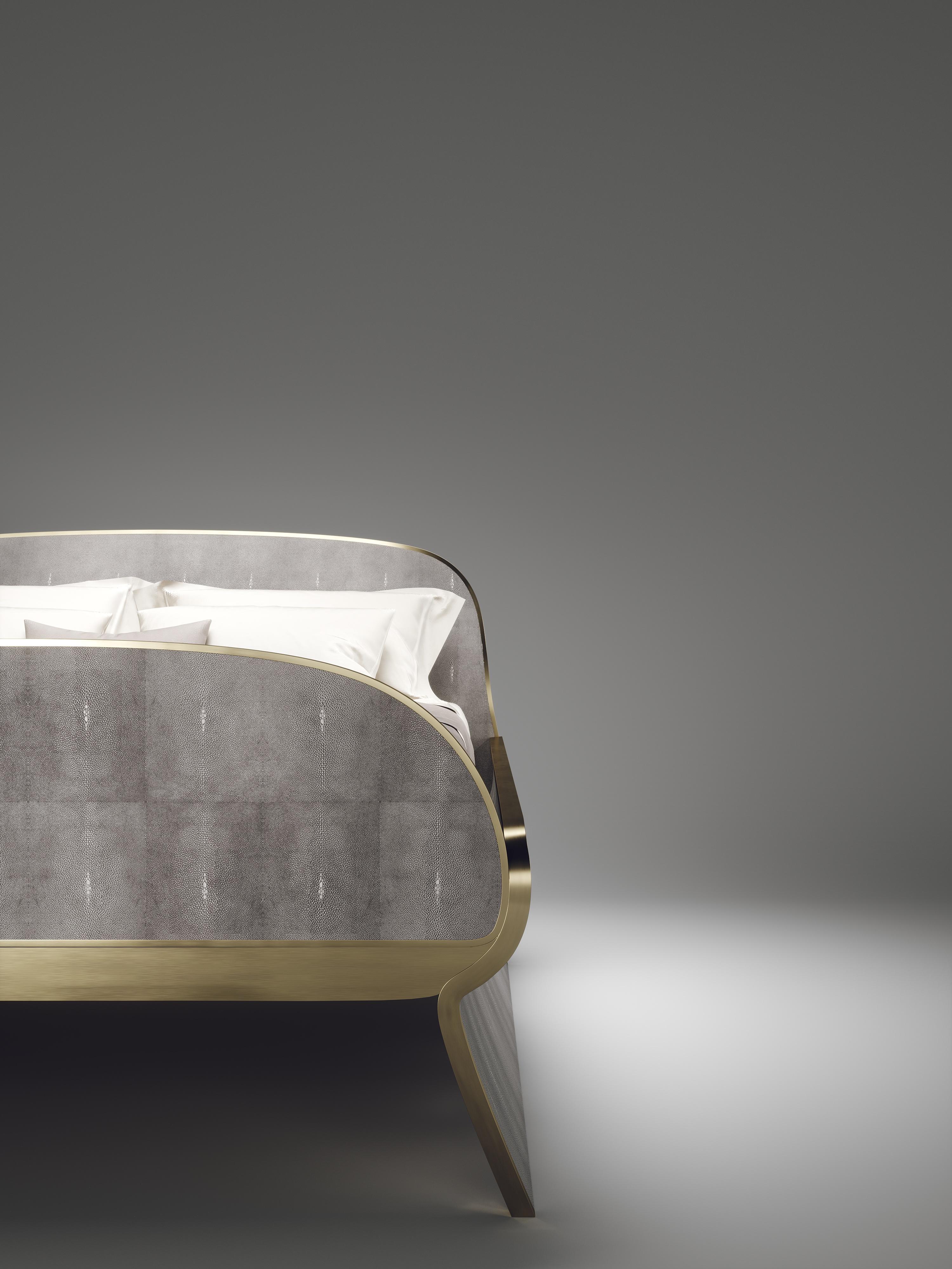The Dandy bed inlaid in light grey shagreen and bronze-patina brass is a one of a kind piece. This modern and elegant design creates a subtle and sculptural statement for any bedroom. This design comes in other finishes as shown in the image slides.