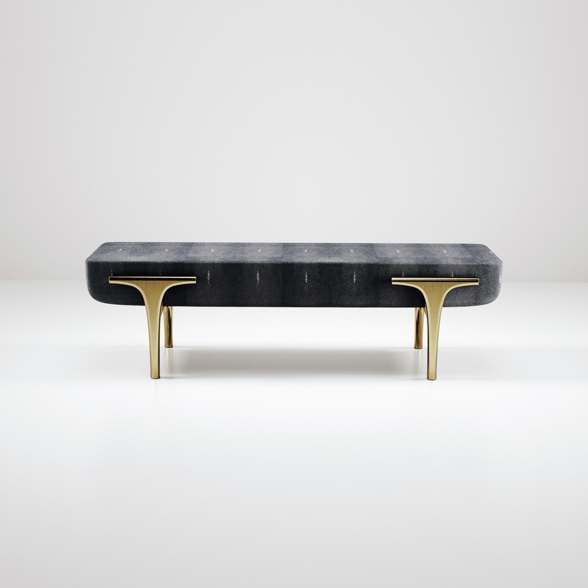 The Ramo bench by R & Y Augousti is an elegant and versatile piece. The coal black shagreen inlaid piece provides comfort while retaining a unique aesthetic with the bronze-patina brass frame and details. This listing is priced for shagreen inlay,