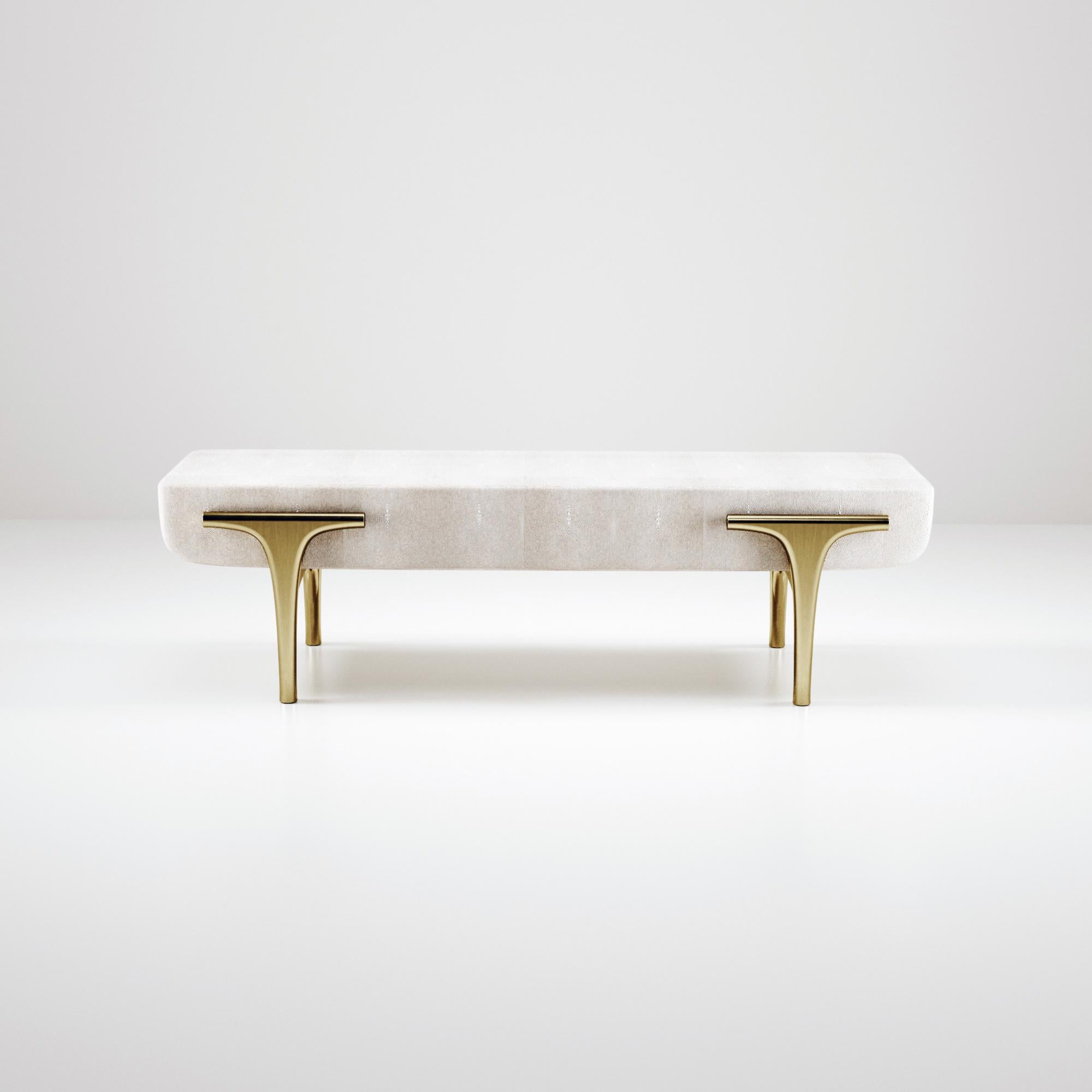 The Ramo Bench by R & Y Augousti is an elegant and versatile piece. The cream shagreen inlaid piece provides comfort while retaining a unique aesthetic with the bronze-patina brass frame and details. This listing is priced for shagreen inlay, see