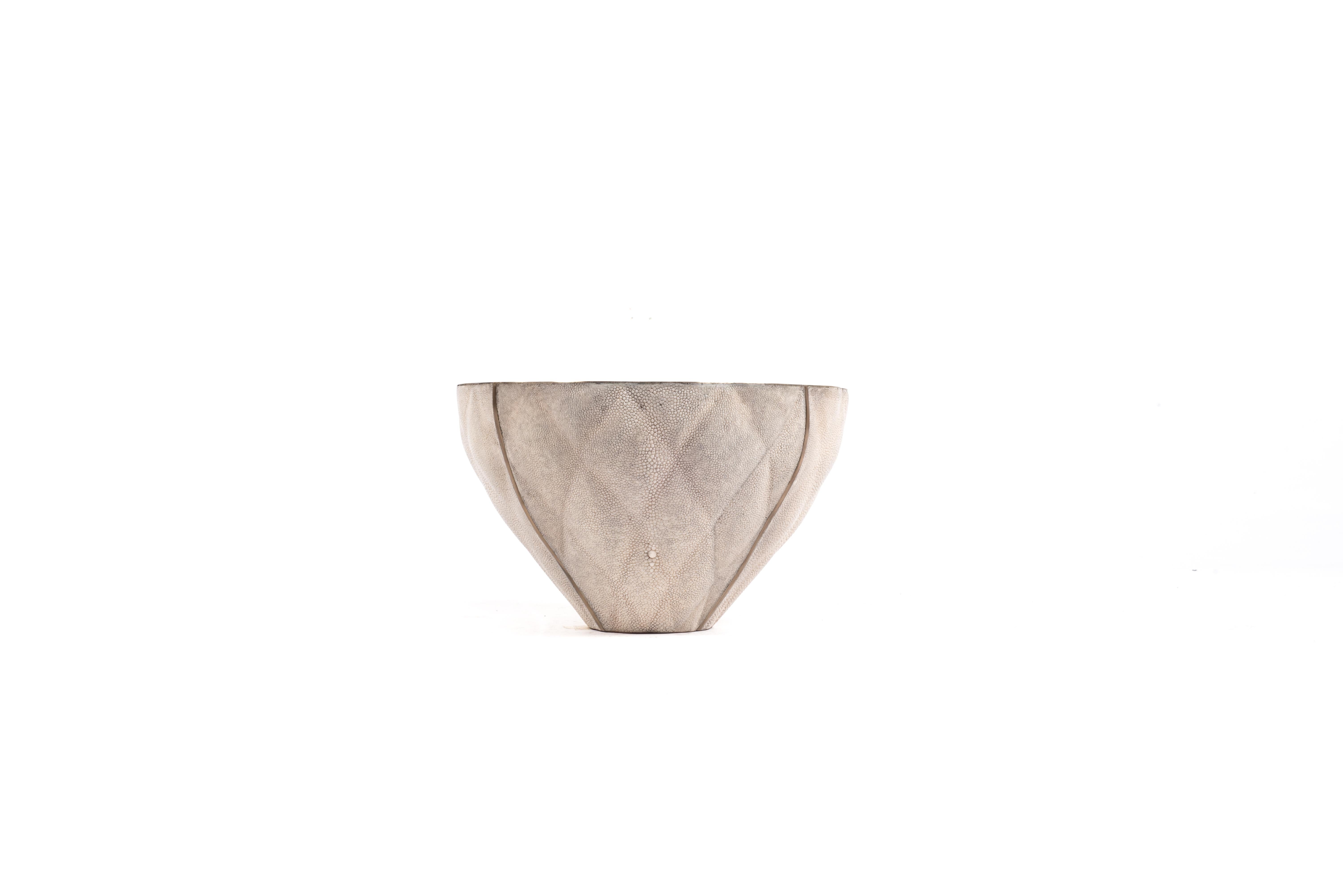 The Coco bowl is a sophisticated and luxurious accent piece with it’s exquisite quilted details. The exterior is inlaid in cream shagreen and the interior in bronze-patina brass. This listing is for the small size, available in a small size and
