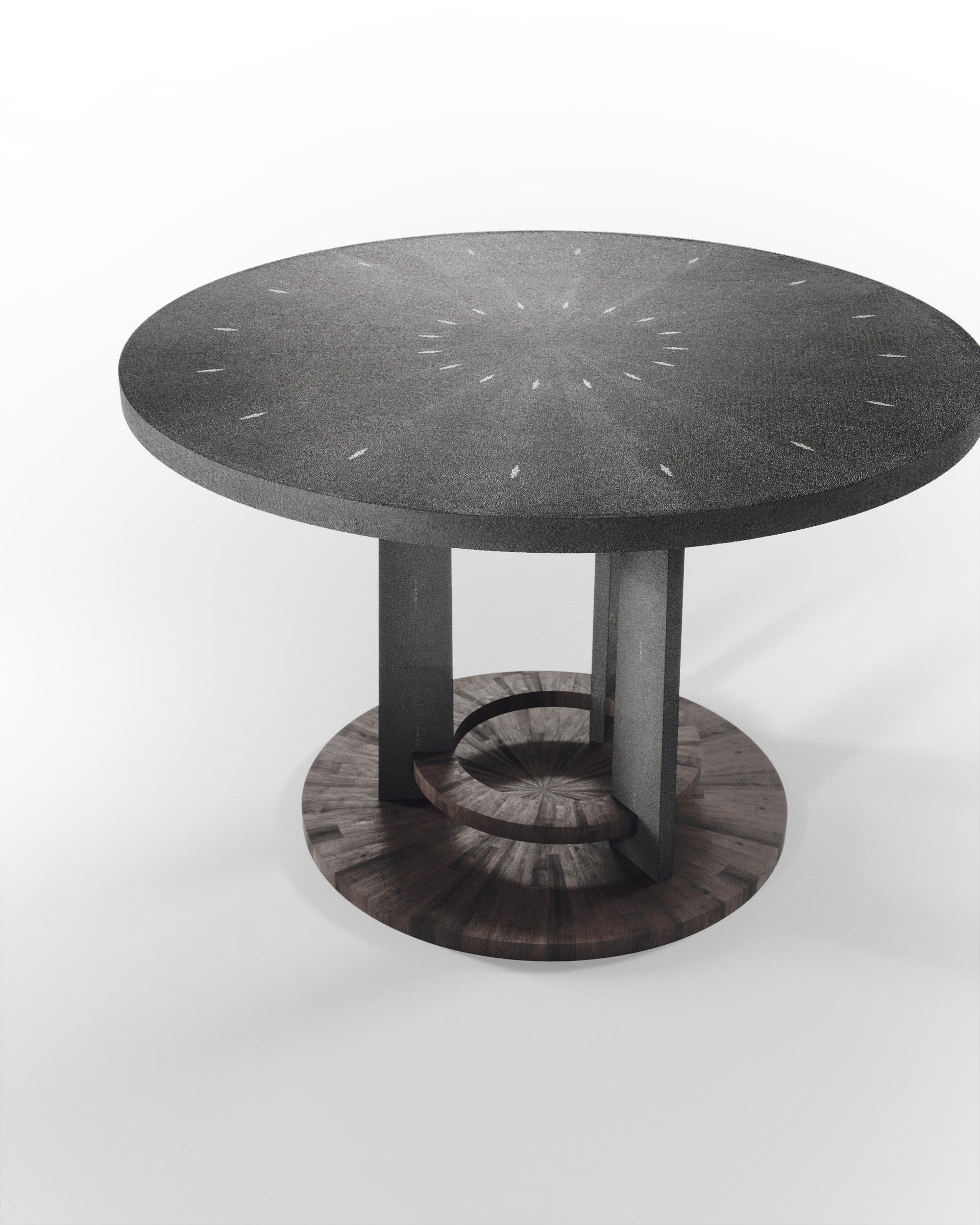 The Prague breakfast table by R&Y Augousti is an iconic design of their collection, debuting from the 1990s. This classic center piece can be adapted for an entrance room or custom-sized for a dining room. The circular shaped coal black shagreen