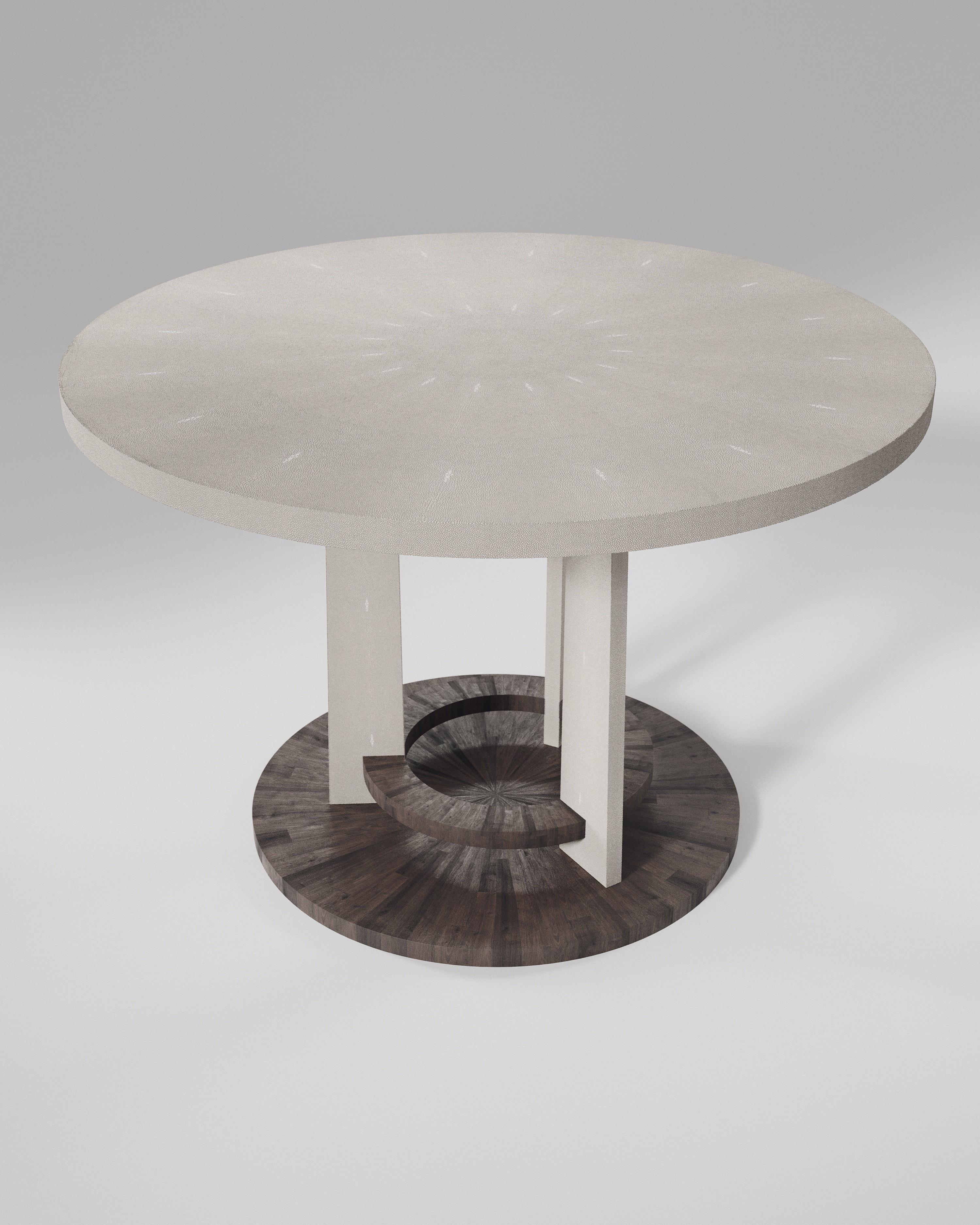The Prague Breakfast table by R&Y Augousti is an iconic design of their collection, debuting from the 1990s. This classic centre piece can be adapted for an entrance room or custom-sized for a dining room. The circular shaped cream shagreen inlaid