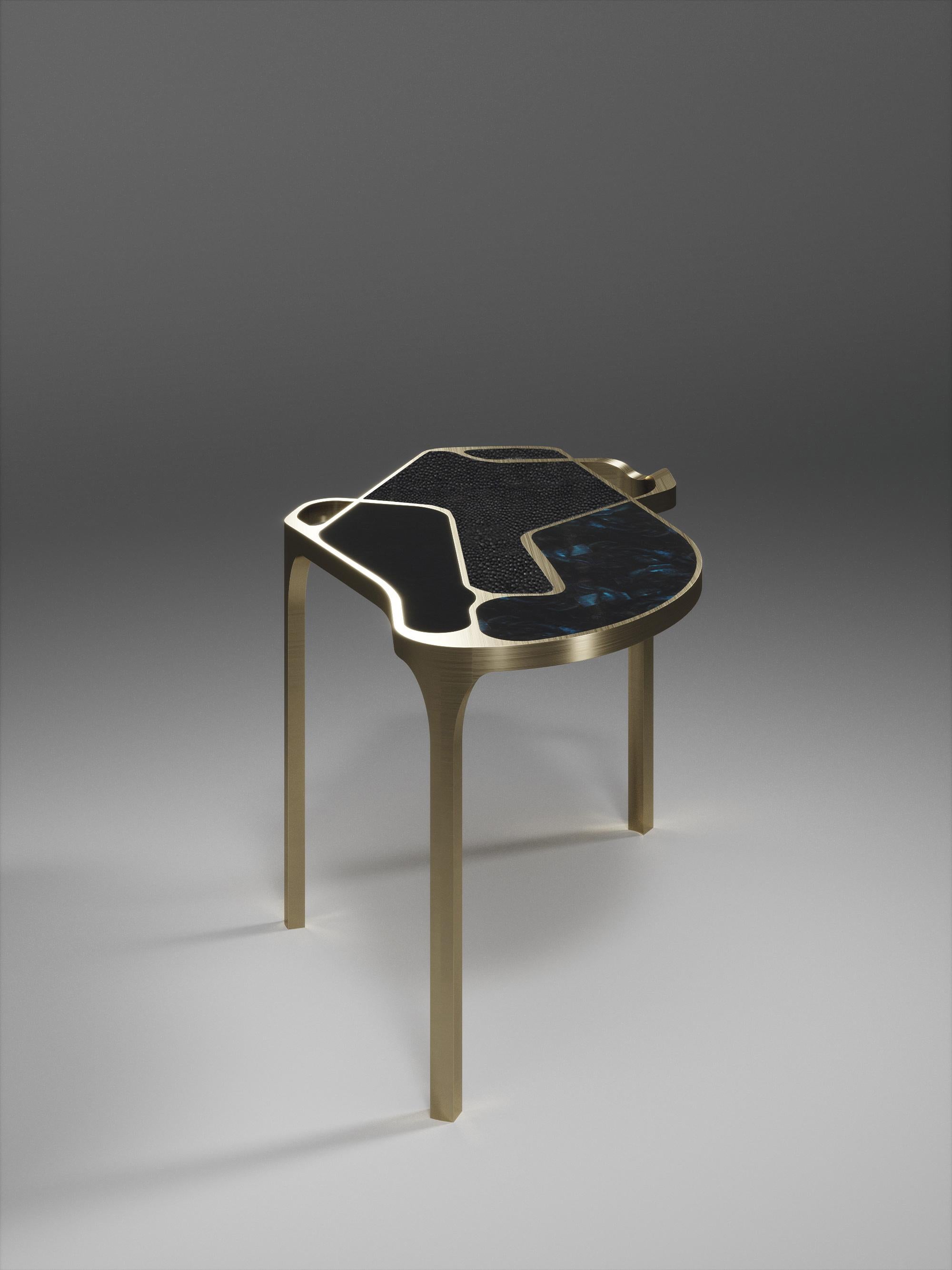 The Cocteau II coffee table by R&Y Augousti is a truly one of a kind piece. The sculptural and ethereal piece has abstract forms, shapes and figures within it that one could interpret in different ways. The bronze-patina brass inserts in the coal