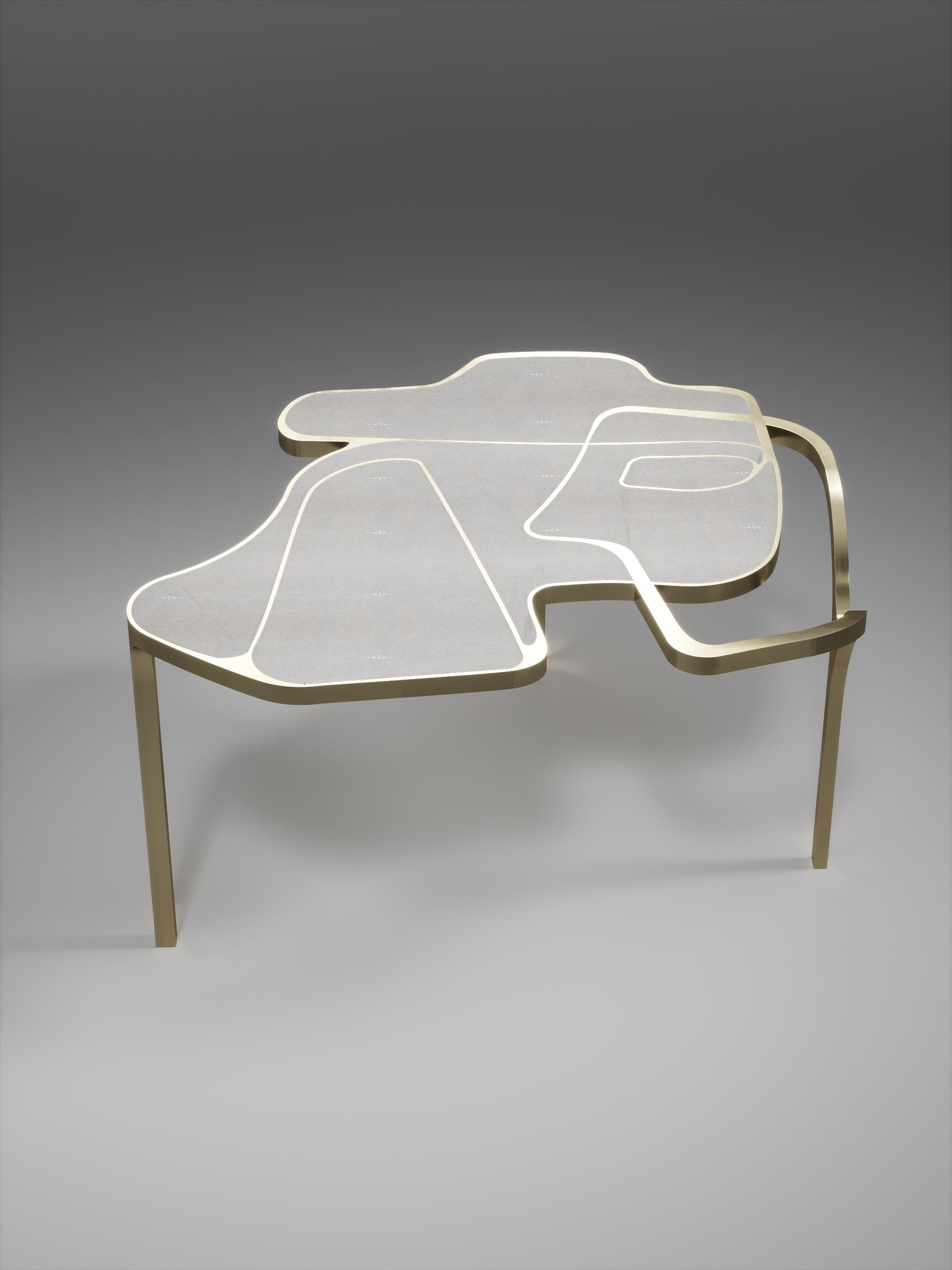 The Cocteau coffee table by R&Y Augousti is a truly one of a kind piece. The sculptural and ethereal piece has abstract forms, shapes and figures within it that one could interpret in different ways. The bronze-patina brass inserts in the cream