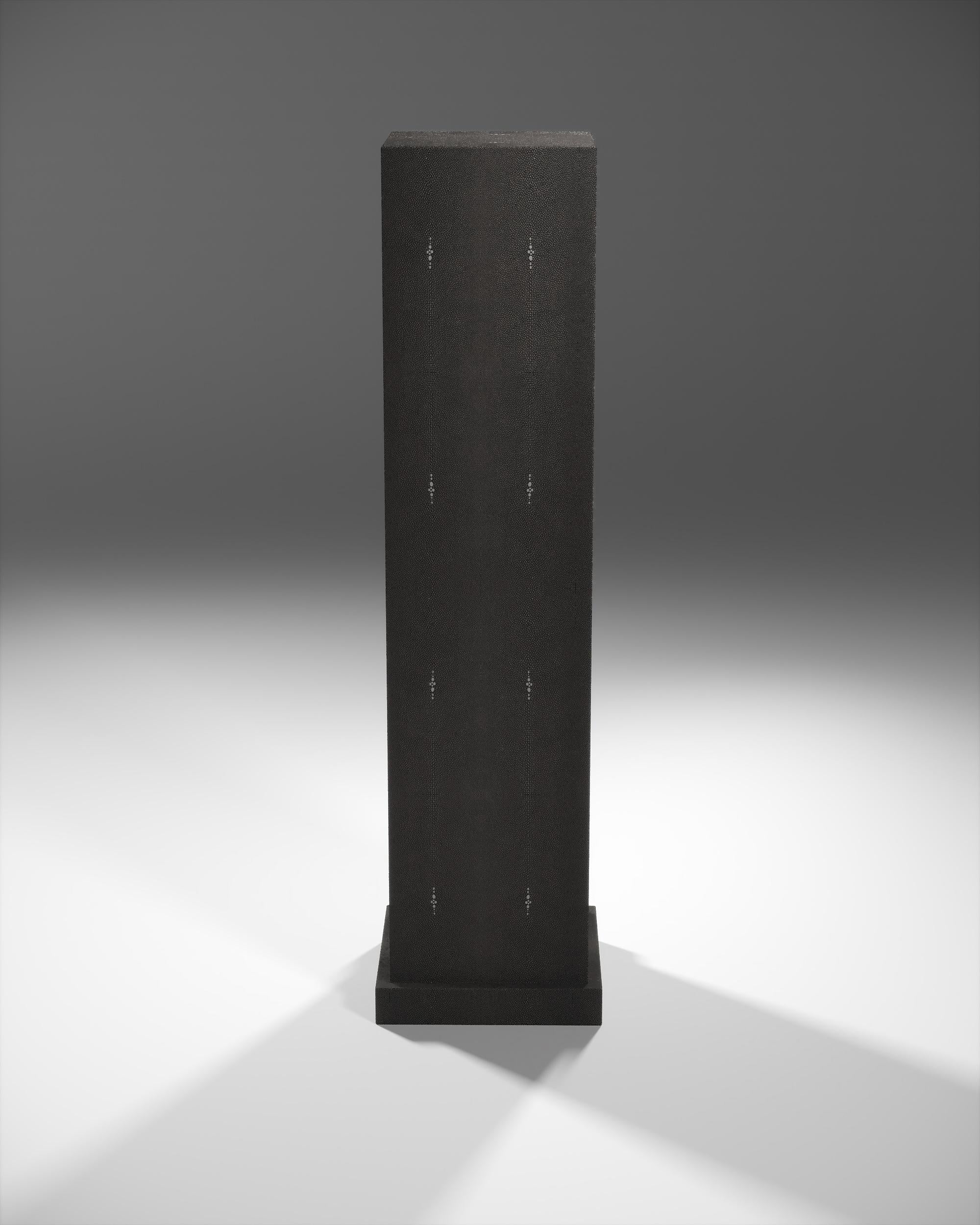 This column in coal black shagreen by R&Y Augousti is the ultimate luxury accent piece to support any decorative objet and make it truly stand out. The design is pure with its clean aesthetic, allowing the beauty of the shagreen inlay to stand out.