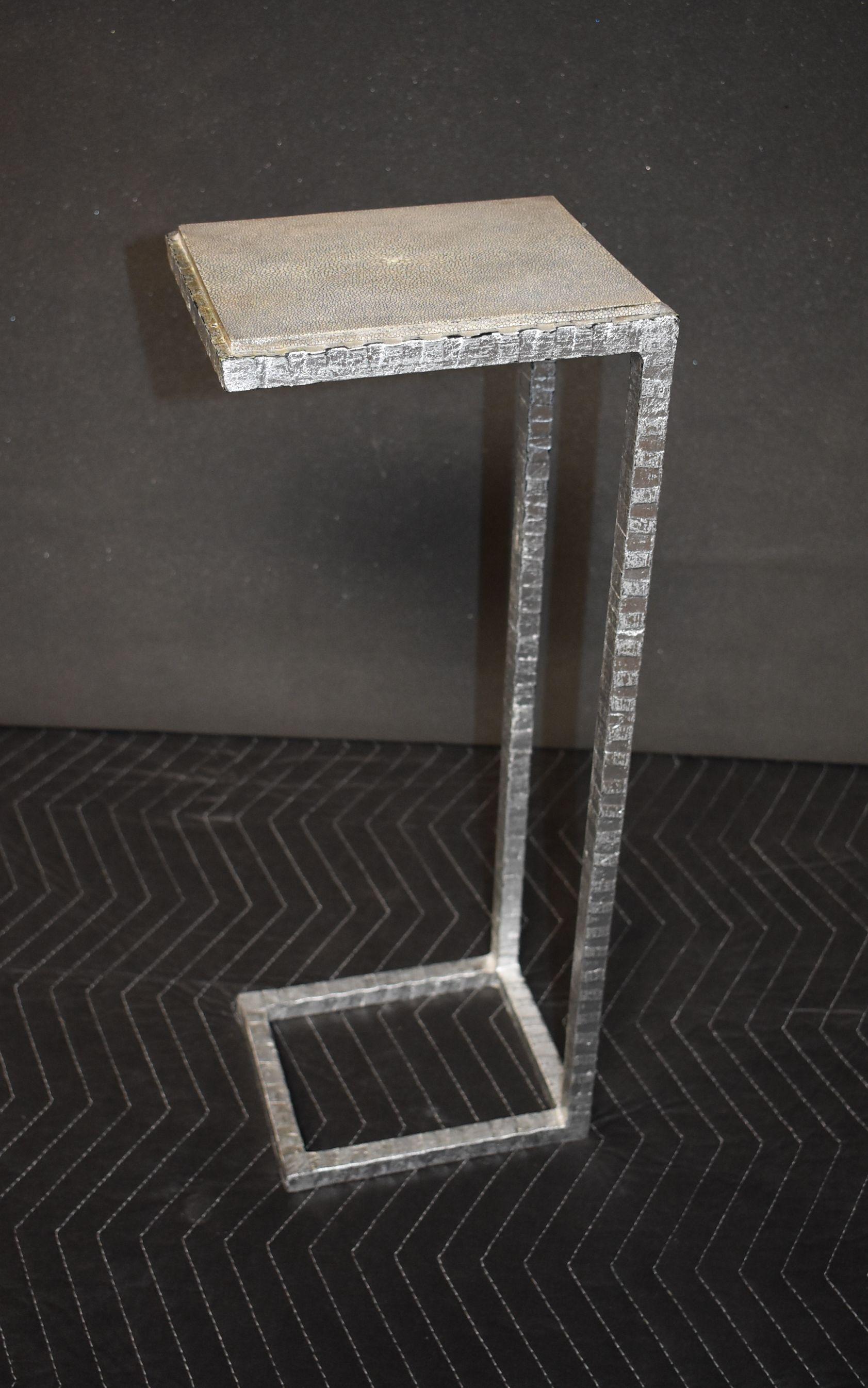 Single gray shagreen top side table with painted silver on metal base.