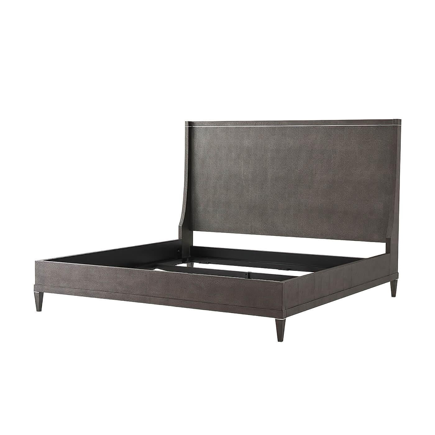 A classic modern Tempest Finish shagreen embossed leather-wrapped queen size bed. The headboard with down swept wings, with polished nickel molding details, a stepped rail frame on square tapered legs. 

Dimensions: 65.5
