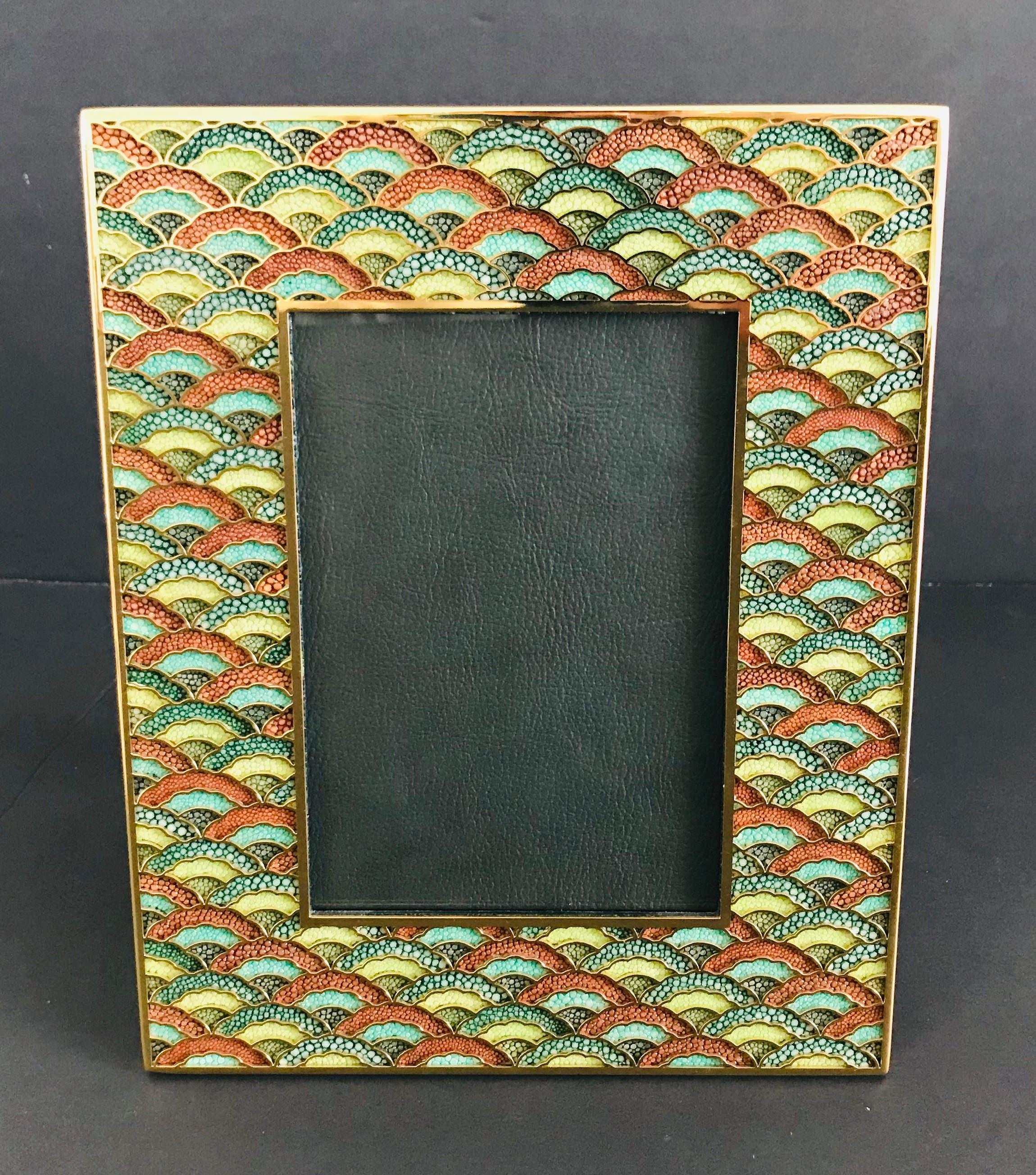 Multi-color shagreen leather and 24 karat gold-plated photo frame by Fabio Ltd
Height: 10.5 inches / Width: 8.5 inches / Depth: 1 inch
Photo size: 5 inches by 7 inches
LAST 1 in stock in Palm Springs ON 50% OFF SALE for $625 !!!
Order Reference #: