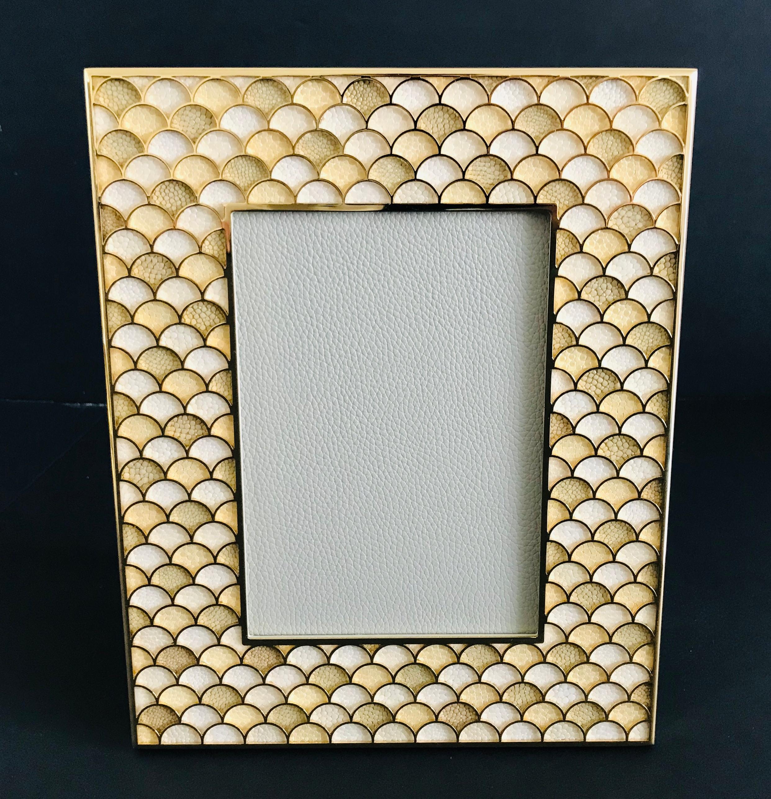 Yellow and ivory shagreen leather and 24 karate gold-plated photo frame by Fabio Ltd
Height: 10.5 inches / Width: 8.5 inches / Depth: 1 inch
Photo size: 5 inches by 7 inches
LAST 1 in stock in Los Angeles
Order Reference #: FABIOLTD PF23
This piece