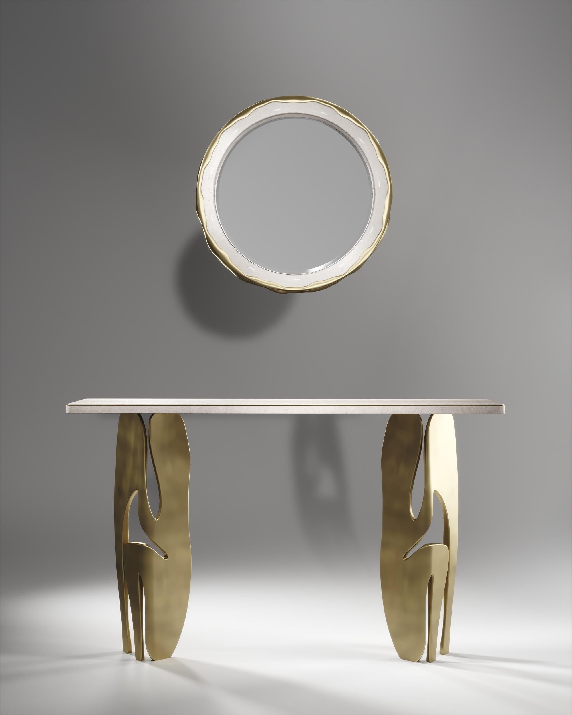 The melting mirror by R&Y Augousti in cream shagreen and bronze-patina brass, is an iconic piece of theirs with their signature 
