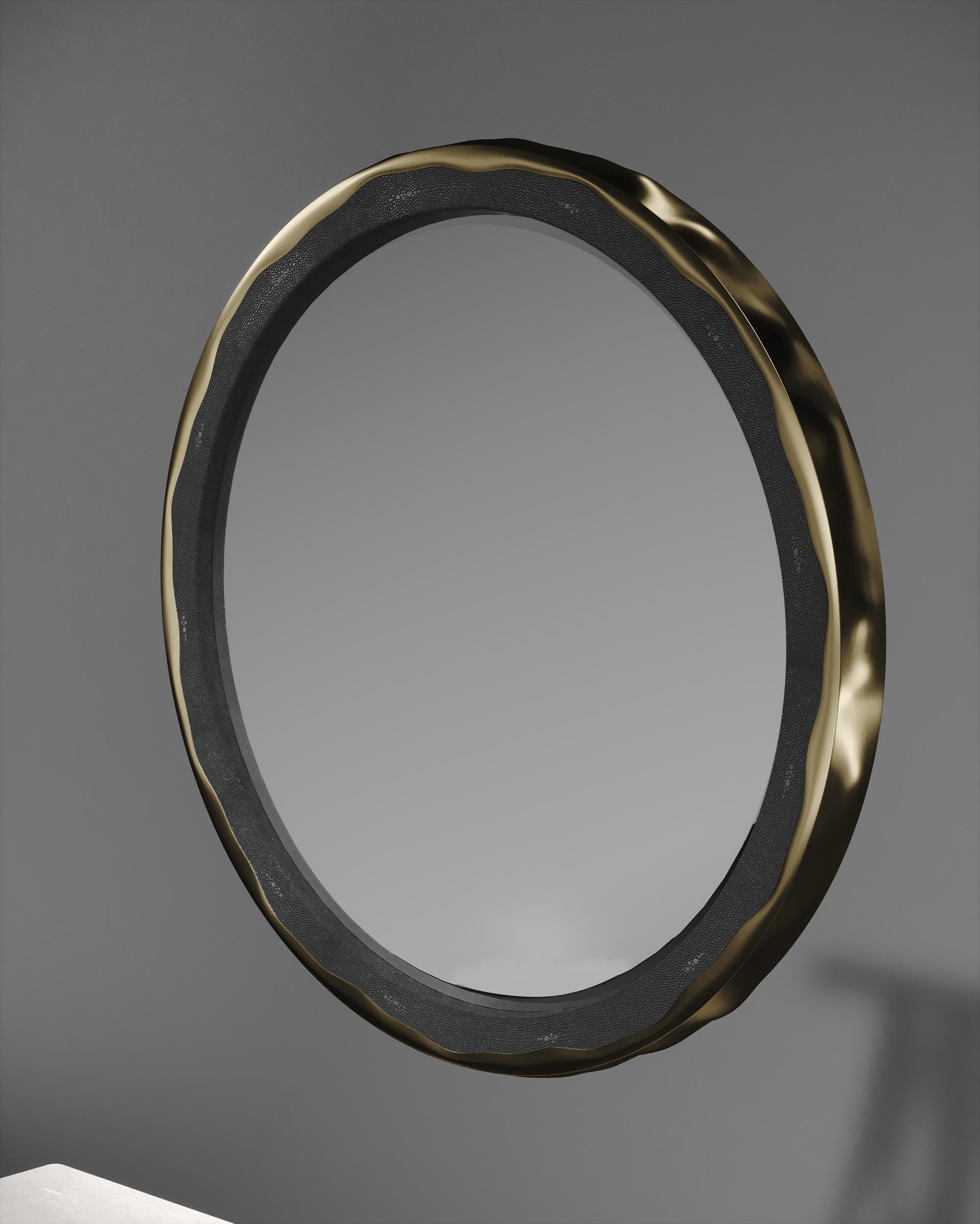 The Melting mirror by R&Y Augousti in coal black shagreen and bronze-patina brass, is an iconic piece of theirs with their signature 