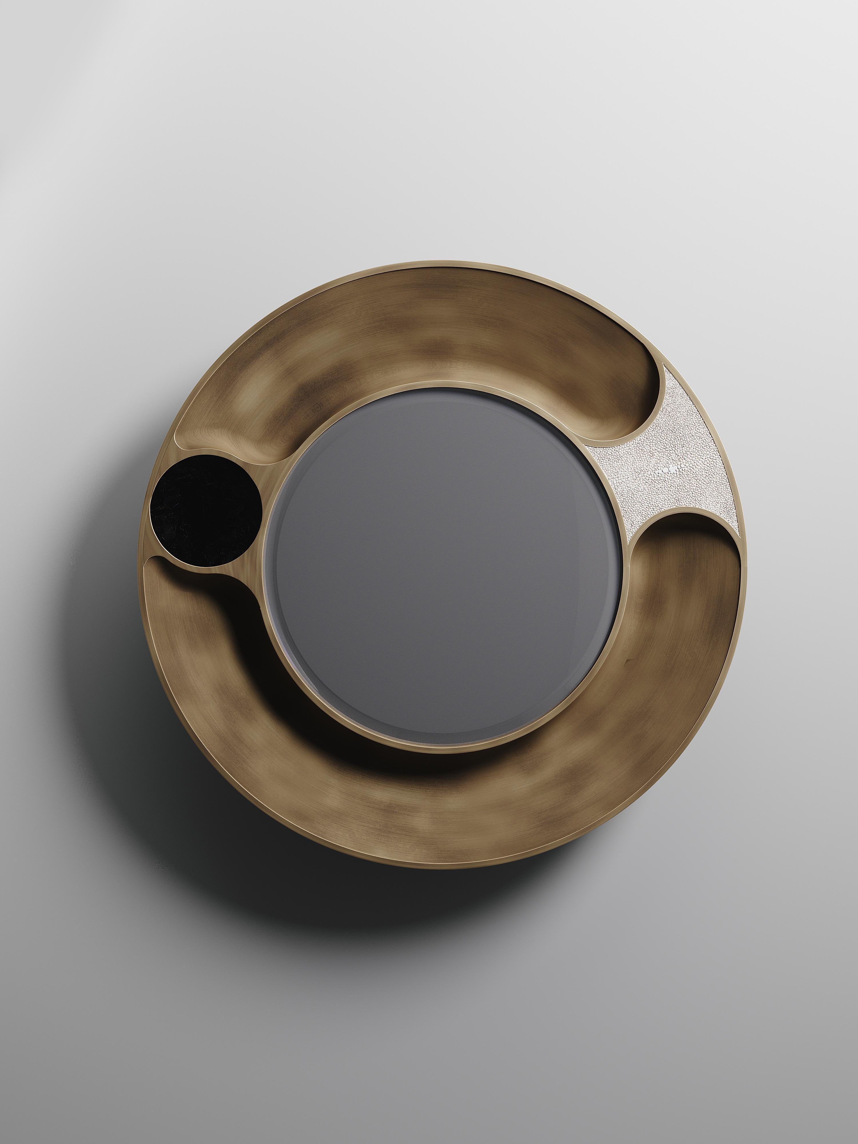 The Iris mirror by R&Y Augousti is an elegant and versatile piece. An abstract interpretation of an eye, the piece is inlaid in a mixture of cream shagreen, black pen shell and bronze patina brass. Custom color and sizing available on request.

The
