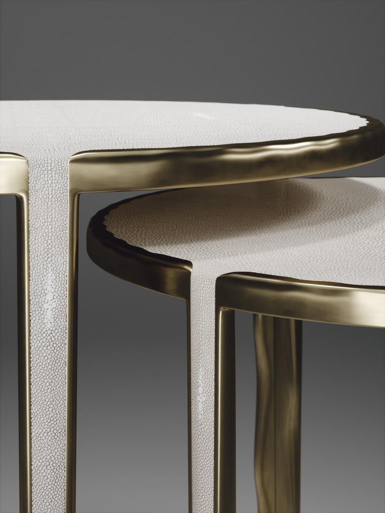 The set of 2 round melting nesting side tables, are the perfect accent pieces for any living space. These are sold as a set of 2 to create elegant and geometric shapes, but one can purchase the tables on their own. The large and medium size are