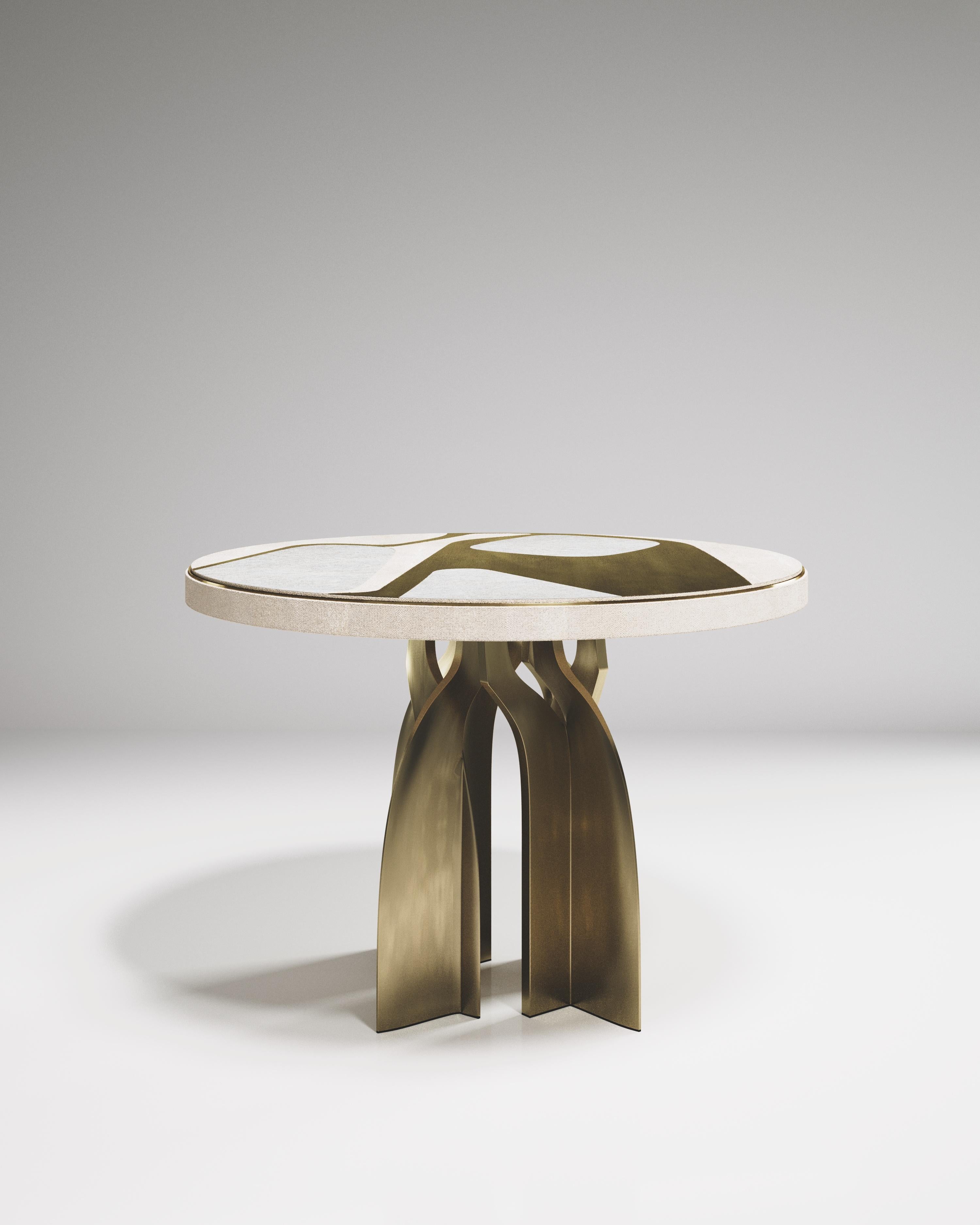 The Chital Breakfast table is a stunning piece, a statement in any space. The mix inlay top in cream shagreen, mother of pearl and bronze-patina brass brings another beautiful dimension to showcase the graphic Cosmos pattern designed by R&Y