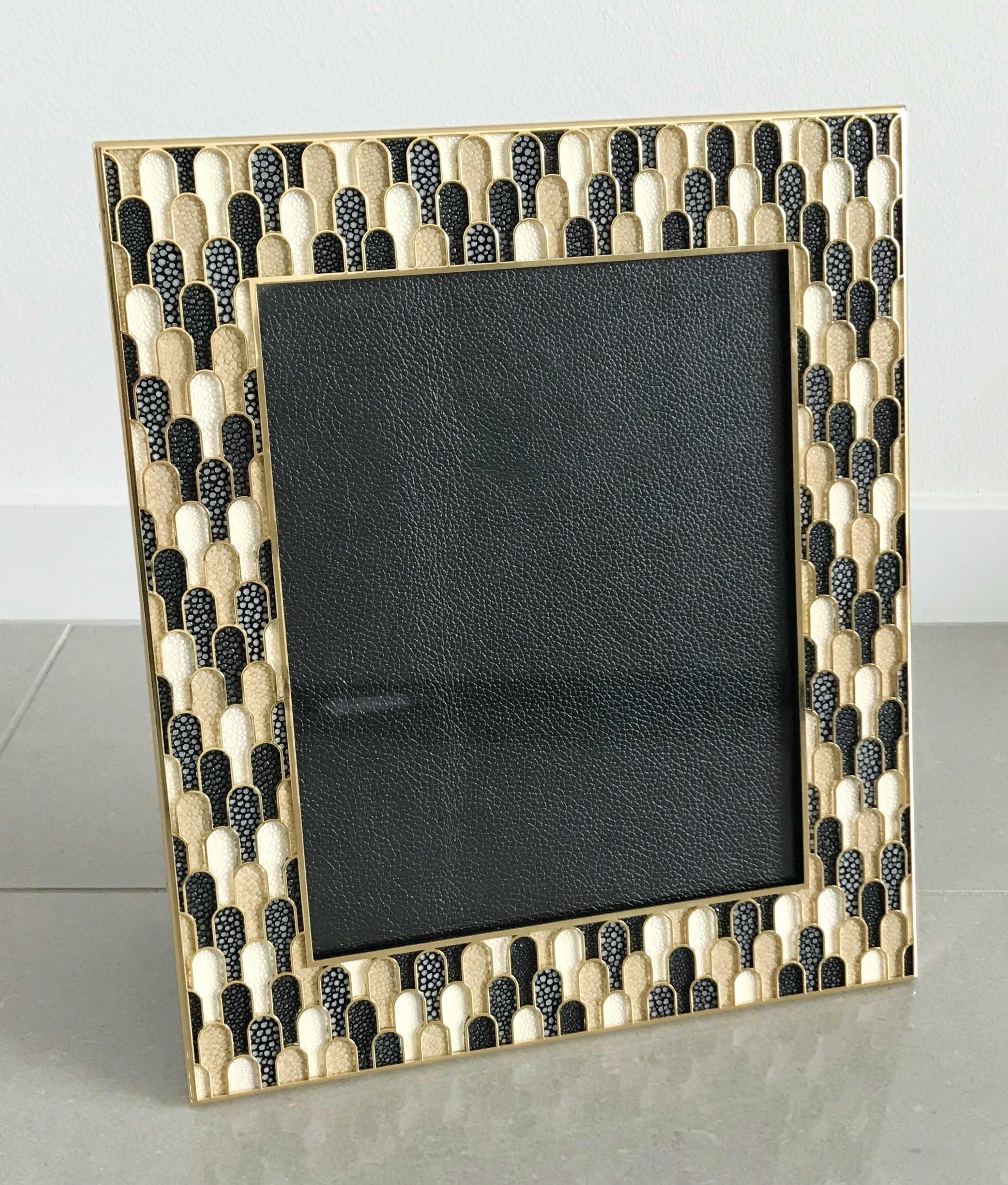 Multi-color shagreen leather and 24 karat gold-plated picture frame by Fabio Ltd
Measures: Height 13.5 inches, width 11.5 inches, depth 1 inch
Photo size: 8 inches by 10 inches
LAST 1 in stock in Los Angeles
Order Reference #: FABIOLTD PF76
This