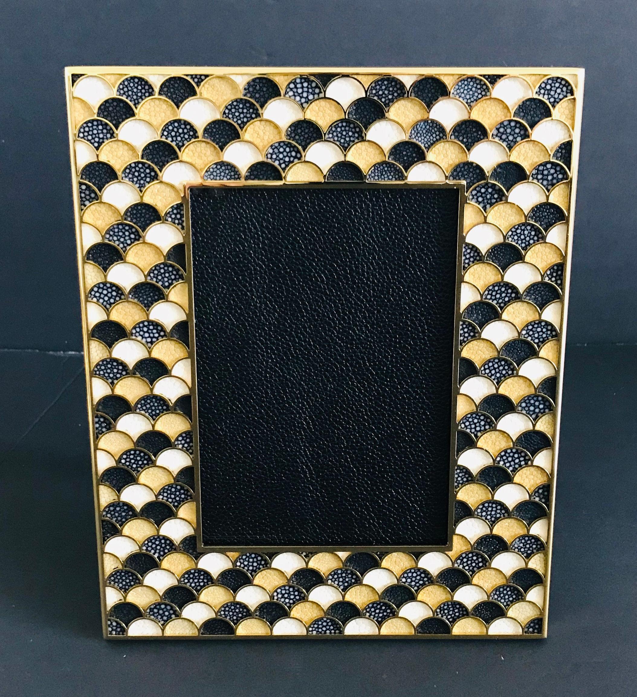 Black, yellow, and ivory shagreen leather and 24-karat gold-plated photo frame by Fabio Ltd
Height: 10.5 inches / Width: 8.5 inches / Depth: 1 inch
Photo size: 5 inches by 7 inches
LAST 1 in stock in Los Angeles
Order Reference #: FABIOLTD PF24
This