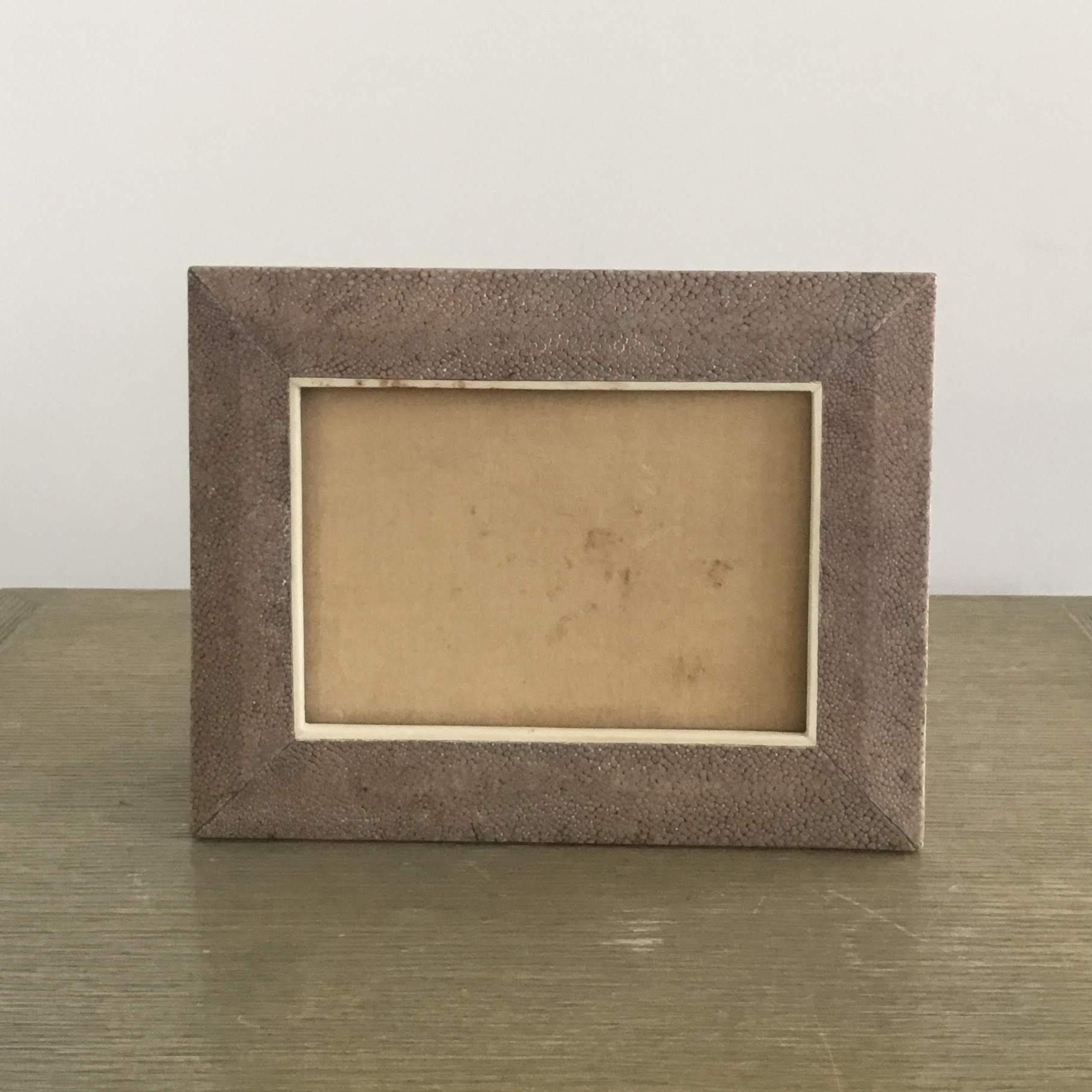 Shagreen picture frame
This is a part of a larger desk set. All pieces are being sold separately.
Accommodates a 5