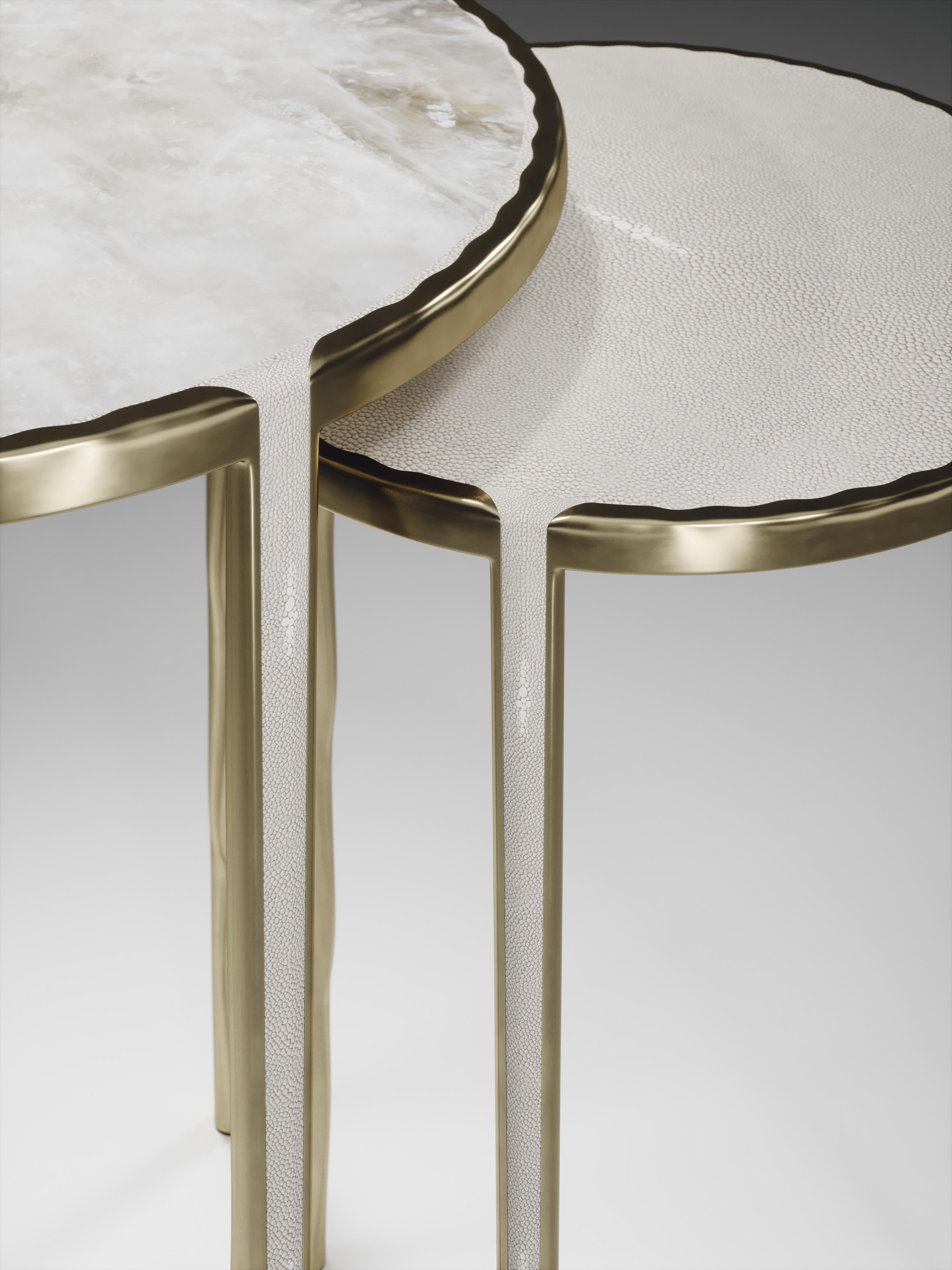 The set of 2 round melting nesting side tables, are the perfect accent pieces for any living space. These are sold as a set of 2 to create elegant and geometric shapes, but one can purchase the tables on their own. The large and medium size are