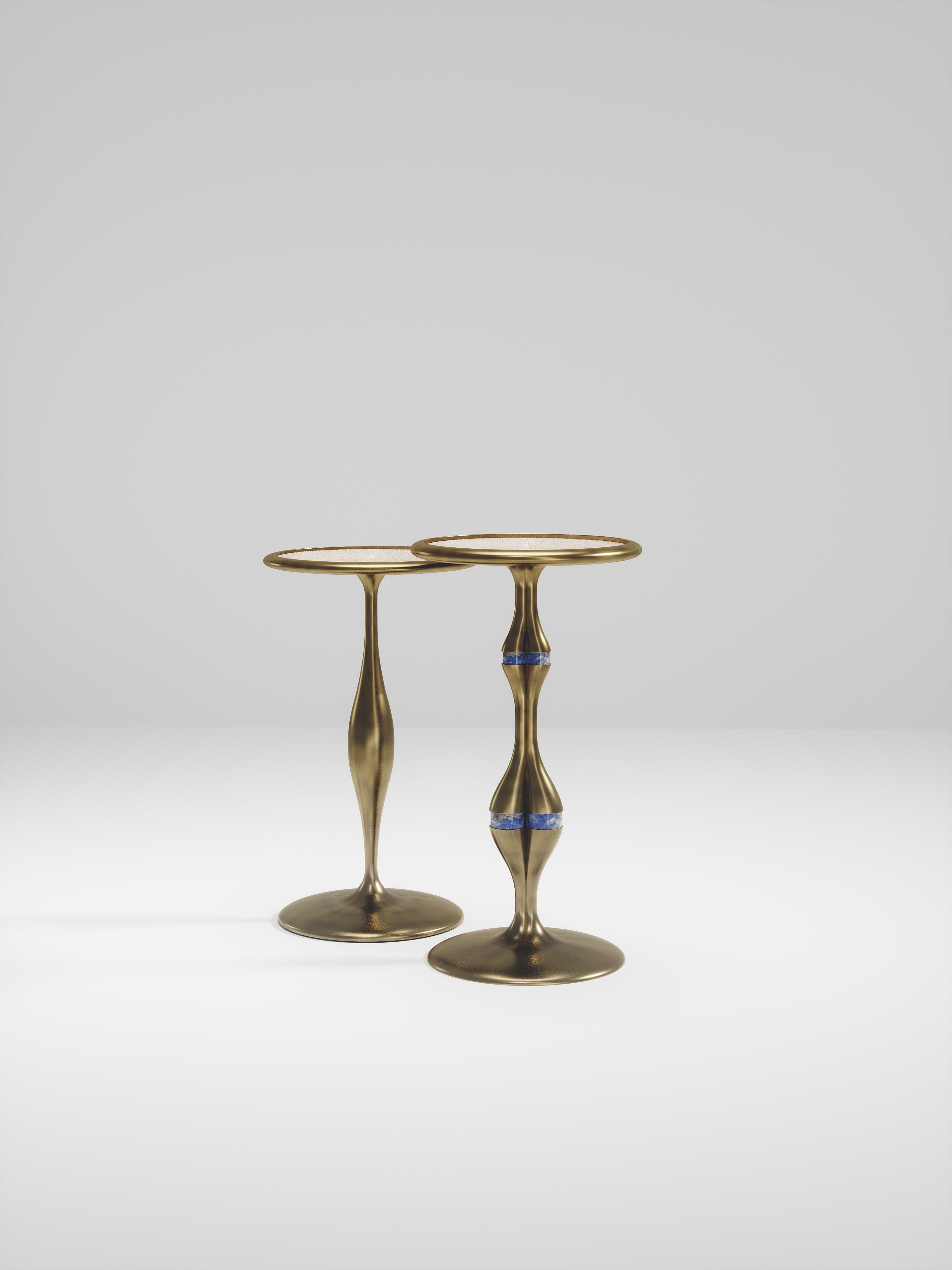 The Frequency Nesting side tables by R & Y Augousti are sleek with a vintage-modern feel. The piece explores fluid organic lines with subtle detailing to create the signature Augousti aesthetic. The piece is inlaid in a mixture of cream shagreen and
