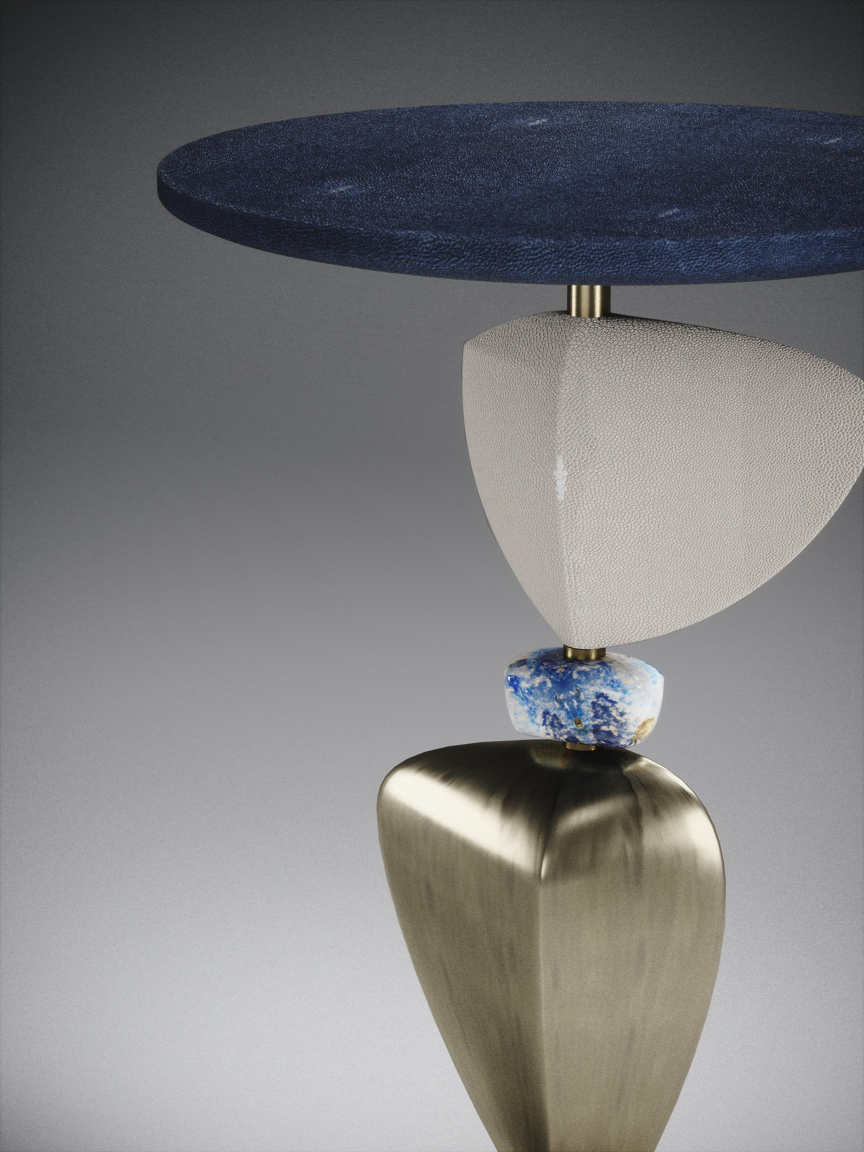 The Cosmo sky side table by Kifu Paris is a whimsical and sculptural piece, inlaid in denim blue shagreen, cream shagreen, lapis lazuli and bronze-patina brass. This piece is a sister to the original Cosmo side table by Kifu Paris, see images at end