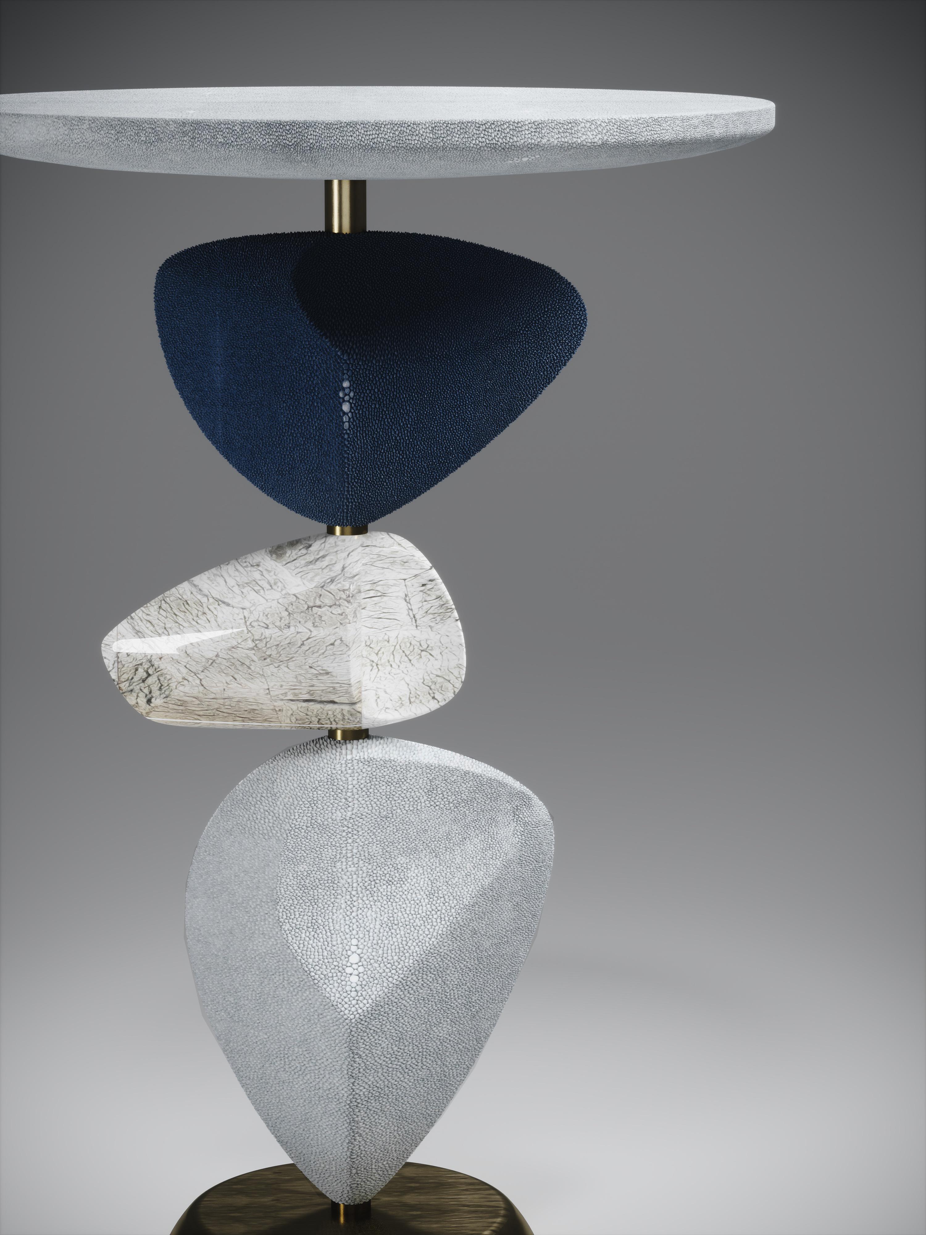 The Cosmo moon side table by Kifu Paris is a whimsical and sculptural piece, inlaid in pale grey blue shagreen shagreen, denim blue shagreen, baguio stone and bronze-patina brass. This piece is a sister to the original Cosmo Side Table by Kifu