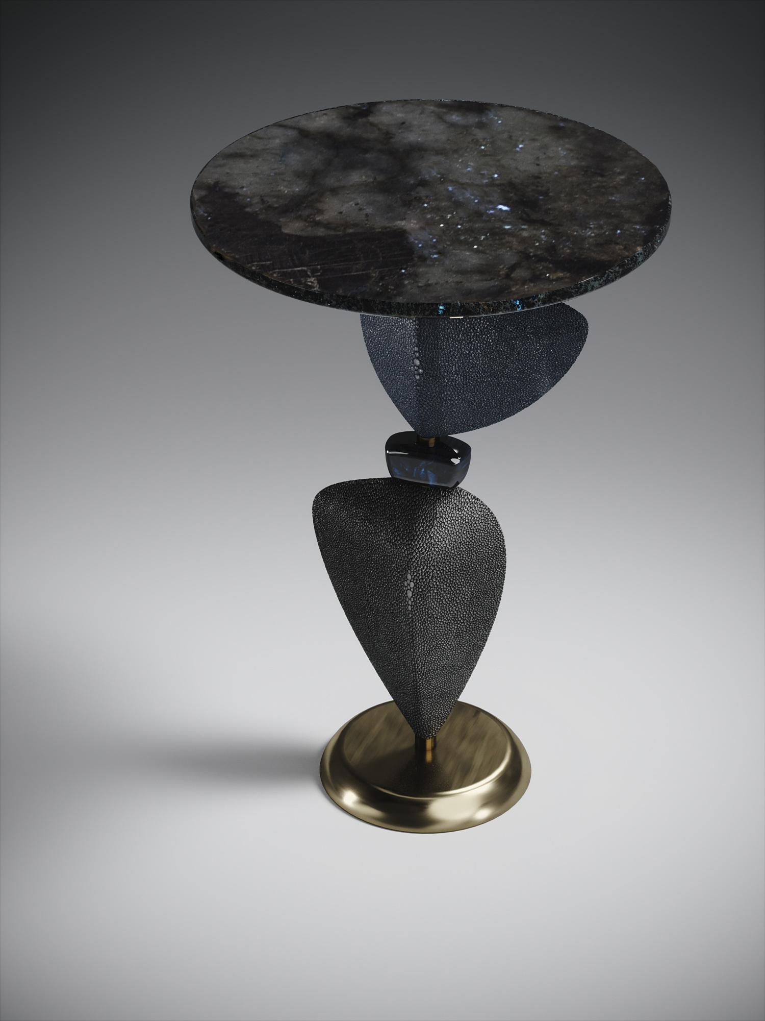 The Cosmo sky side table by Kifu Paris is a whimsical and sculptural piece, inlaid in Lemurian, dark denim blue shagreen, blue pen shell, coal black shagreen and bronze-patina brass. This piece is a sister to the original Cosmo Side Table by Kifu
