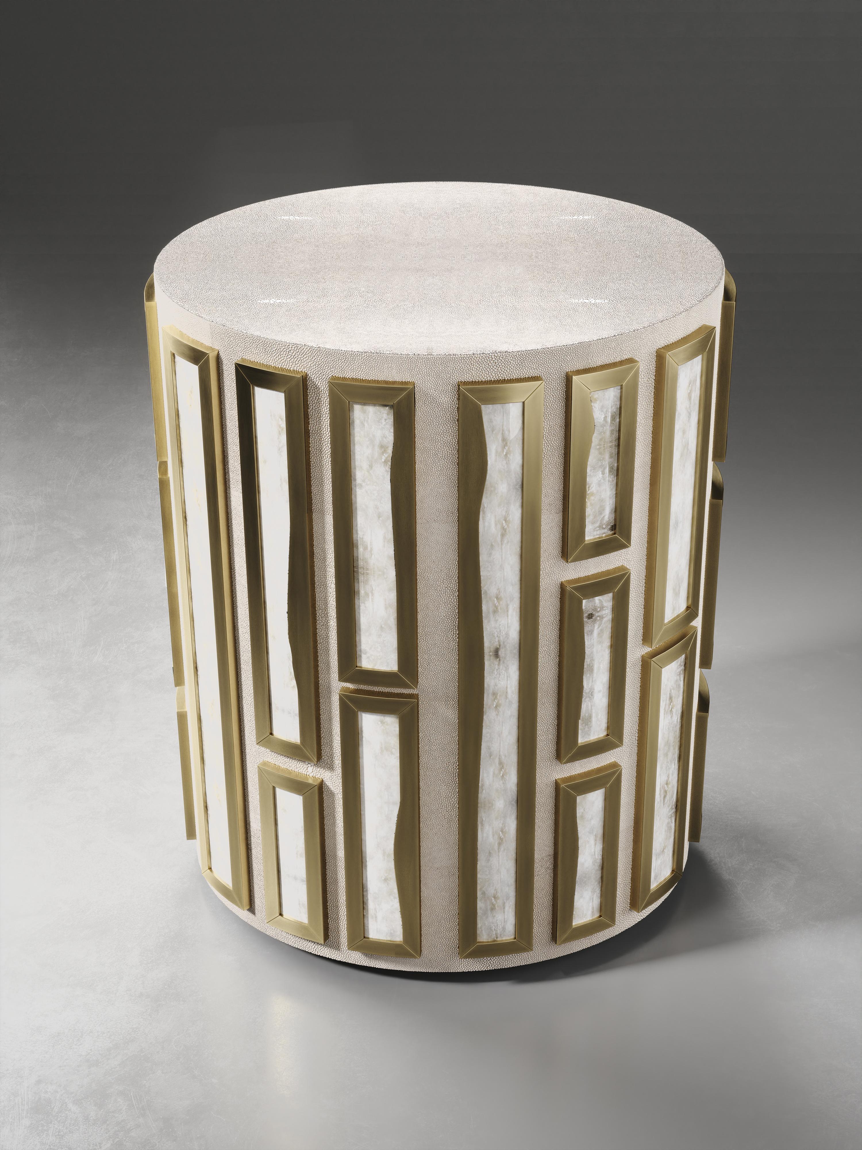 The Talisa side table by R&Y Augousti is originally inspired by the jewelry chest version of it (see images at end of slide). This circular piece is a solid structure inlaid in cream shagreen and bejeweled with raised intricate white quartz inserts
