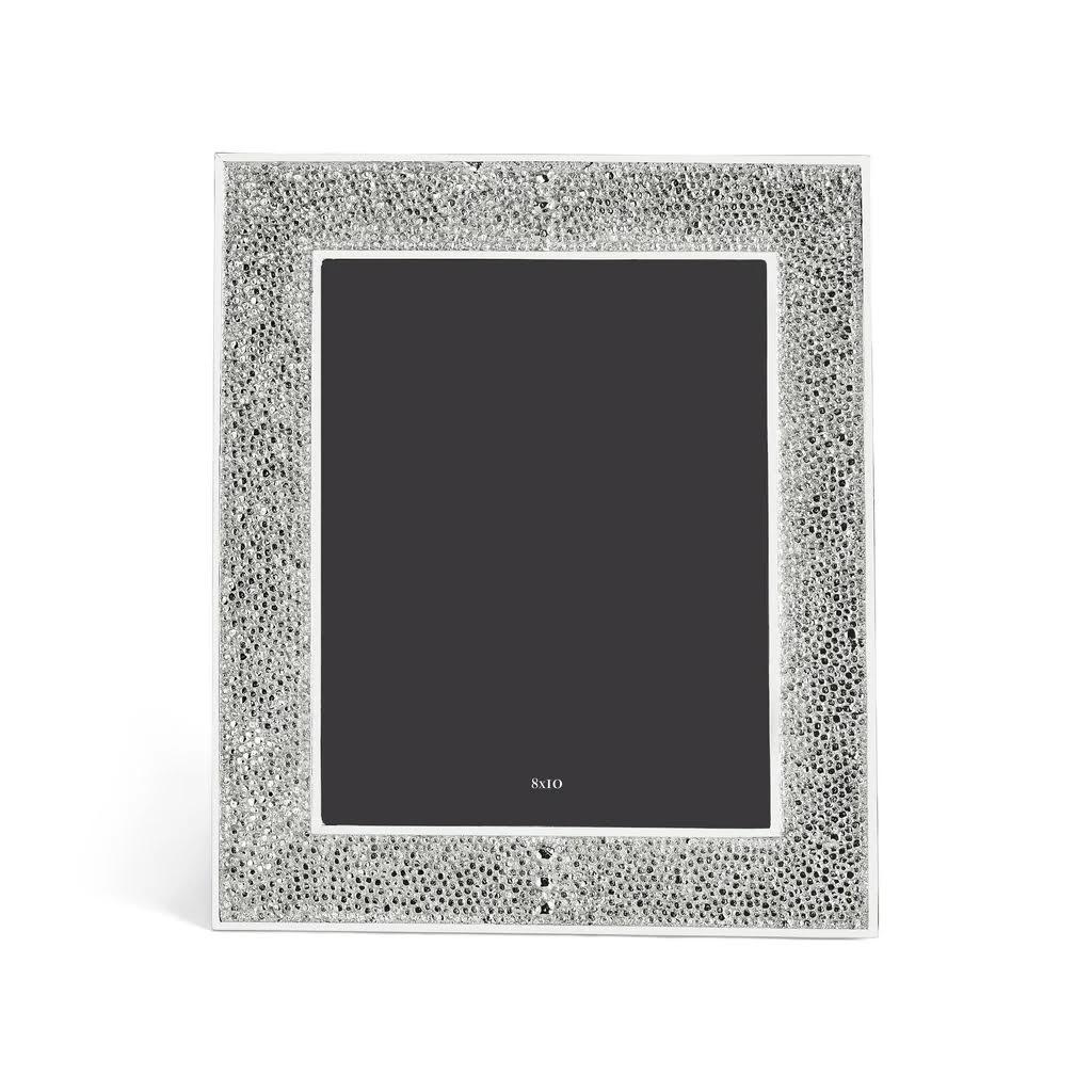 Shagreen-style nickel-plated steel frame - photo frame imitating shark leather in hand-forged nickel with matt finish.



Description:

The Shagreen Collection interprets the subtle shimmer and granulated texture of natural stingray leather,