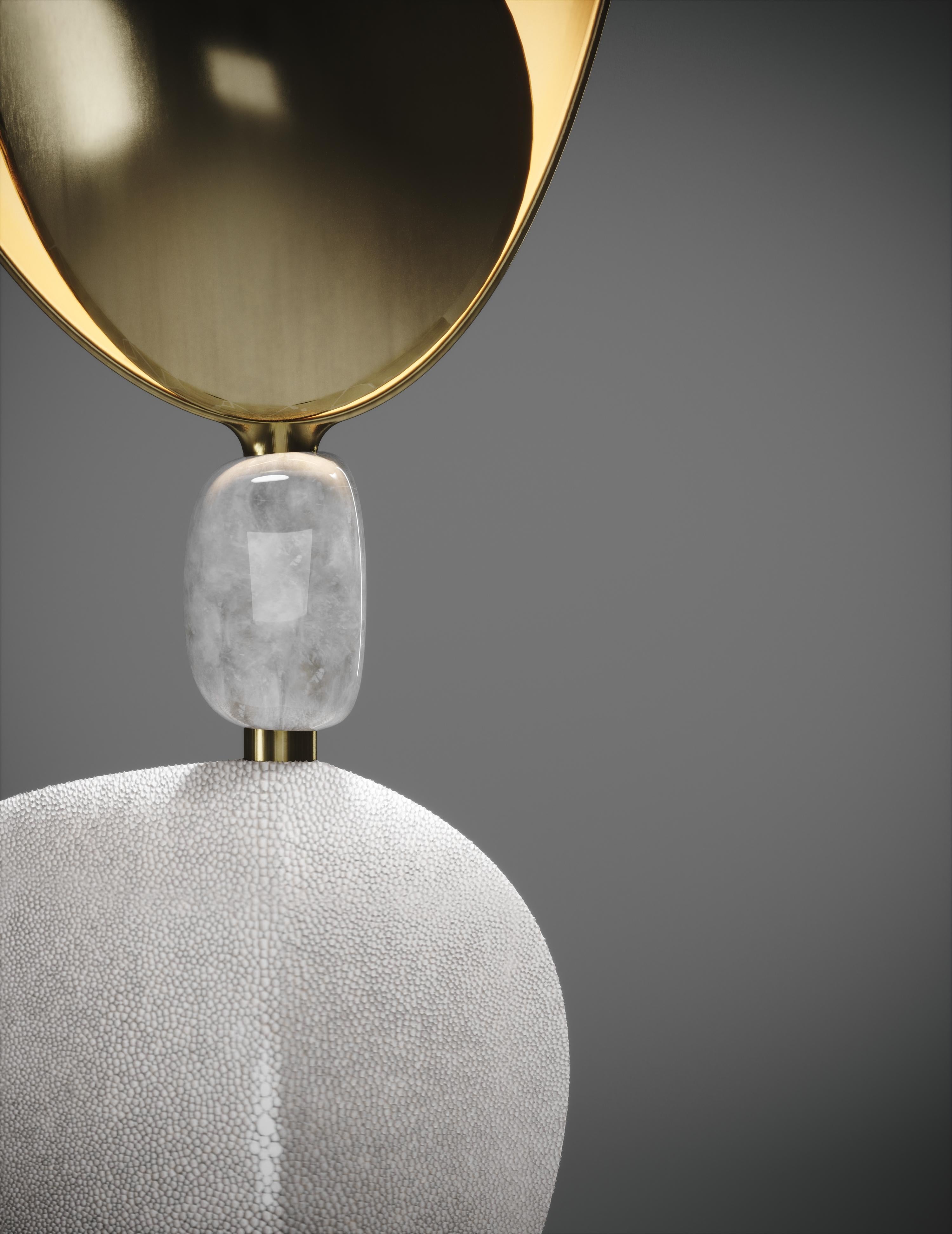 The Cosmo Bird table lamp by Kifu Paris is a whimsical and sculptural piece, inlaid in cream shagreen and bronze-patina brass with a beautiful quartz piece in the center. The amorphous shapes are an abstract and poetic reinterpretation of a bird